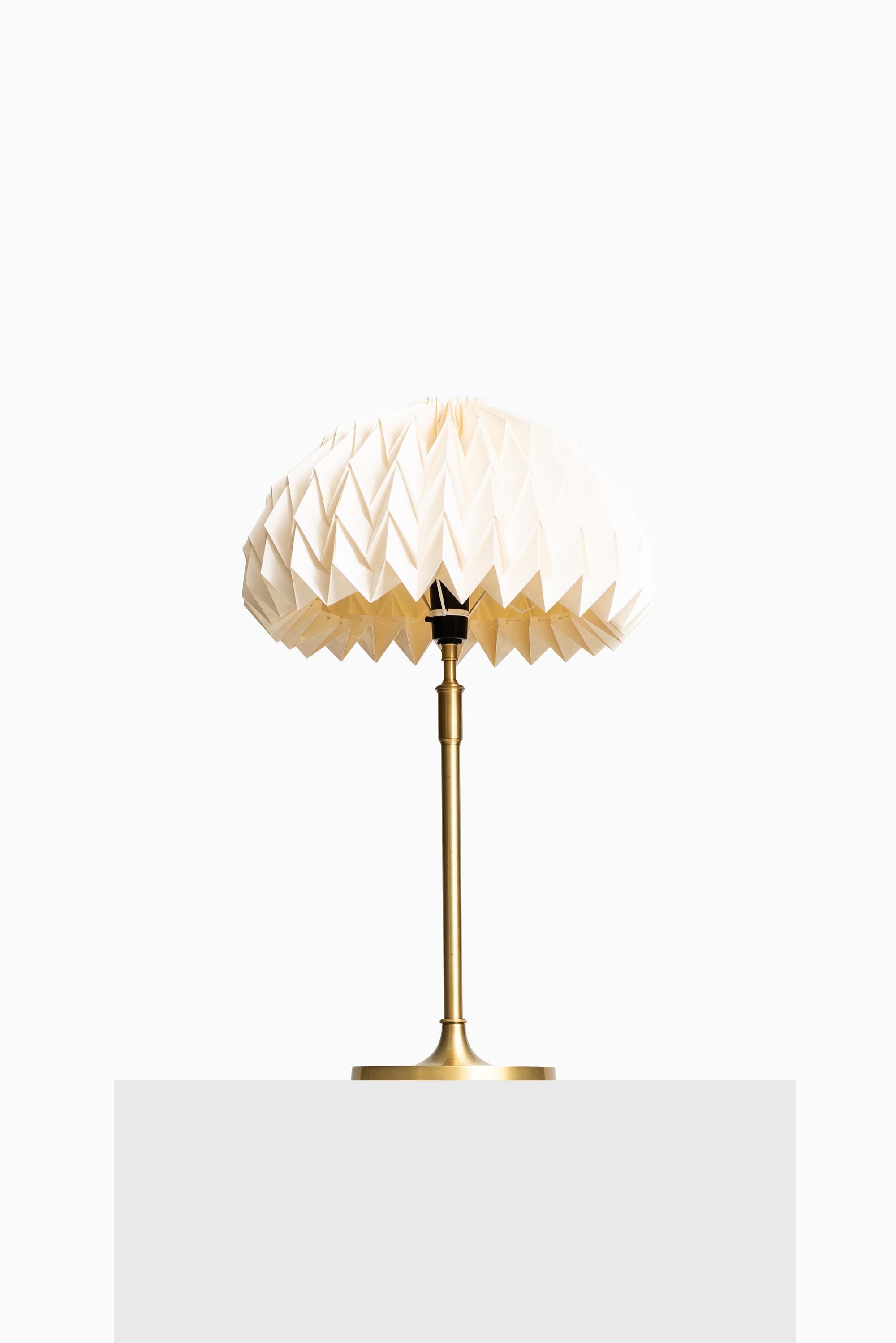 Rare pair of height adjustable table lamps model 307 designed by Esben Klint. Produced by Le Klint in Denmark.