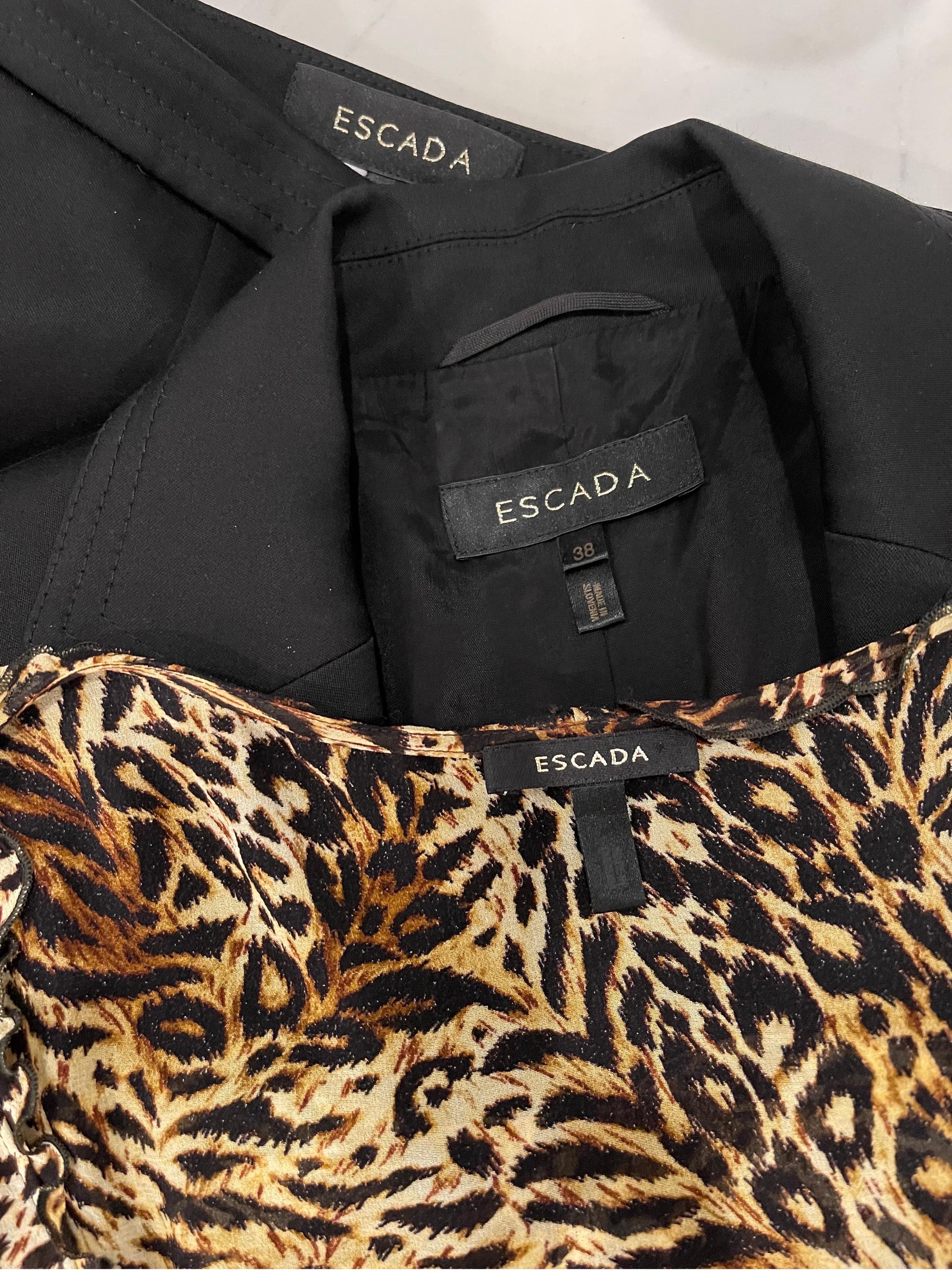 Amazing early 2000s vintage ESCADA 3 piece ensemble ! Features a tailored black jacket with leopard lining and an attached leopard chiffon tie at waist. Sleeveless leopard chiffon blouse. Flare leg trousers also feature leopard chiffon panels on the