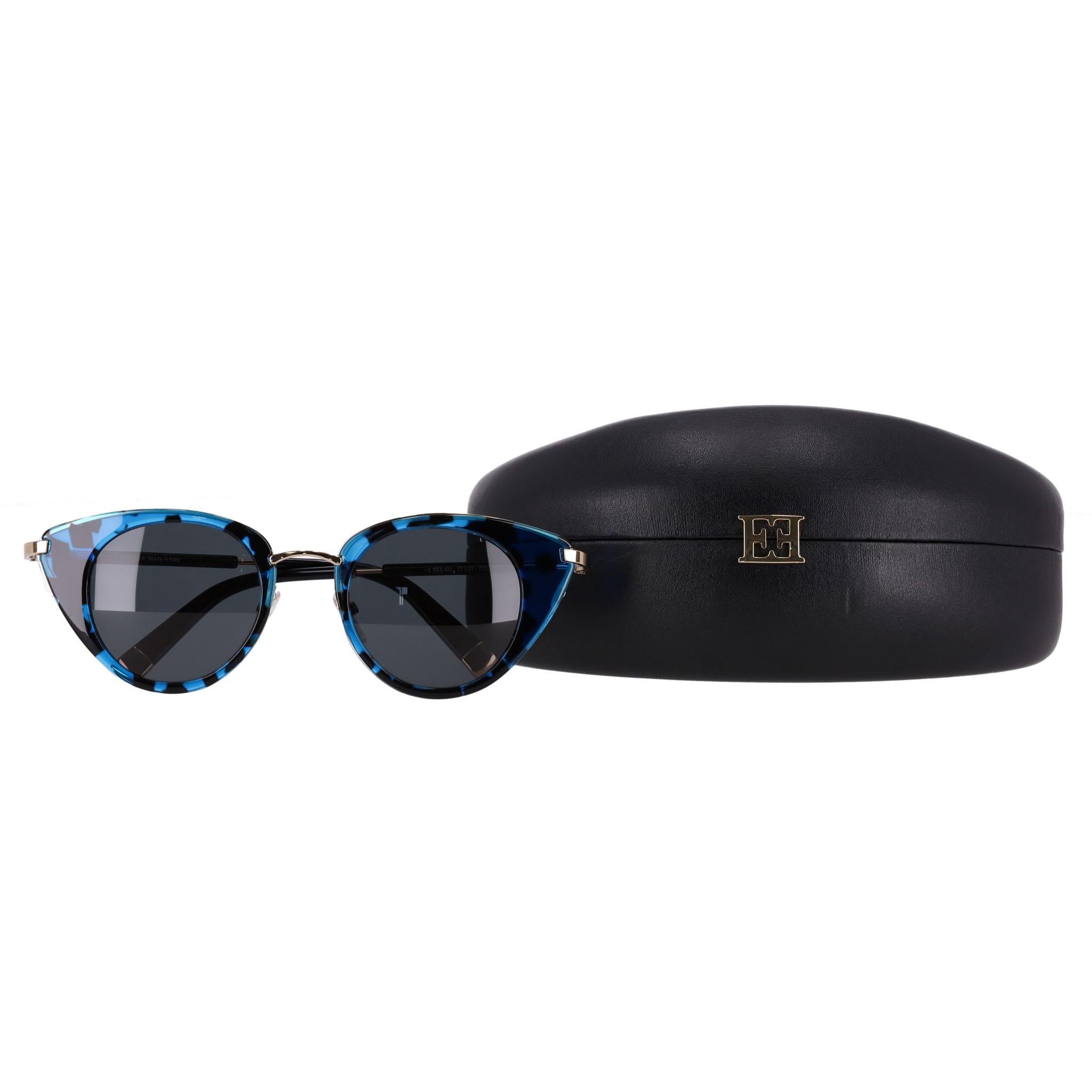 Escada Abstract Cat-Eye Sunglasses

Abstract design in black and vibrant blue in a cat-eye shape.

Featuring grey lenses, gold arms with 'Escada' signature to the side and logo engraved temple tips.

Rrp Approx. £250

Size – One Size

Condition –