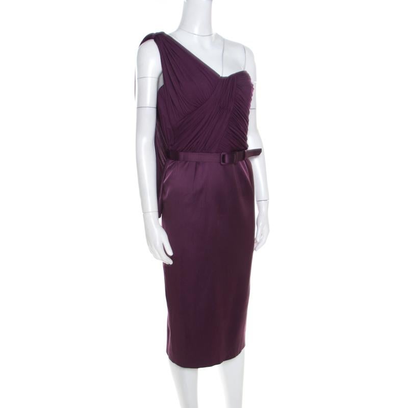 This breathtaking aubergine dress is from Escada. This dress wins with its feminine design, draped bodice, asymmetric sleeve and midi hemline. It has a smooth feel and a belt at the waist which adds to the overall design.

Includes:  Info Booklet,