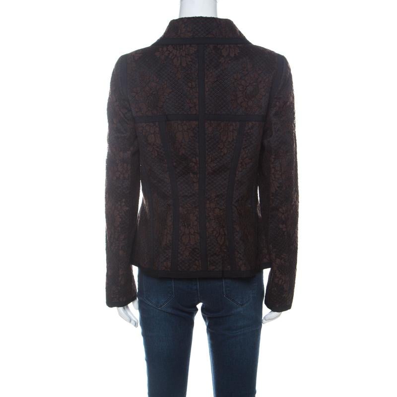 The much loved label Escada leaves no occasion to charm us and it yet again wins our hearts with this brown jacket. It is made of a blend of cotton and nylon and features a black lace overlay. It flaunts a collared neckline, button fastenings, two