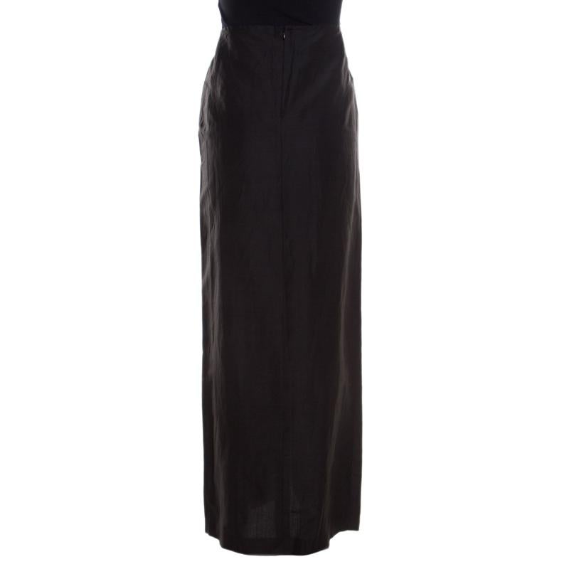 This gorgeous skirt from Escada will surely grab your attention. It is tailored in a combination of linen and silk in black color. The maxi skirt features a button front detail and a zip closure at the back.

Includes: The Luxury Closet Packaging,