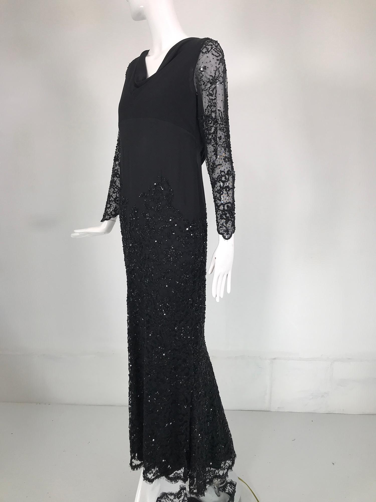 Escada black silk, lace & sequin, long sleeve gown with short train. Long black, sequin lace sleeve gown with a drape neck. The body of the dress is black silk, dress is fitted through the bodice, there are sequins rising from the hem to the mid