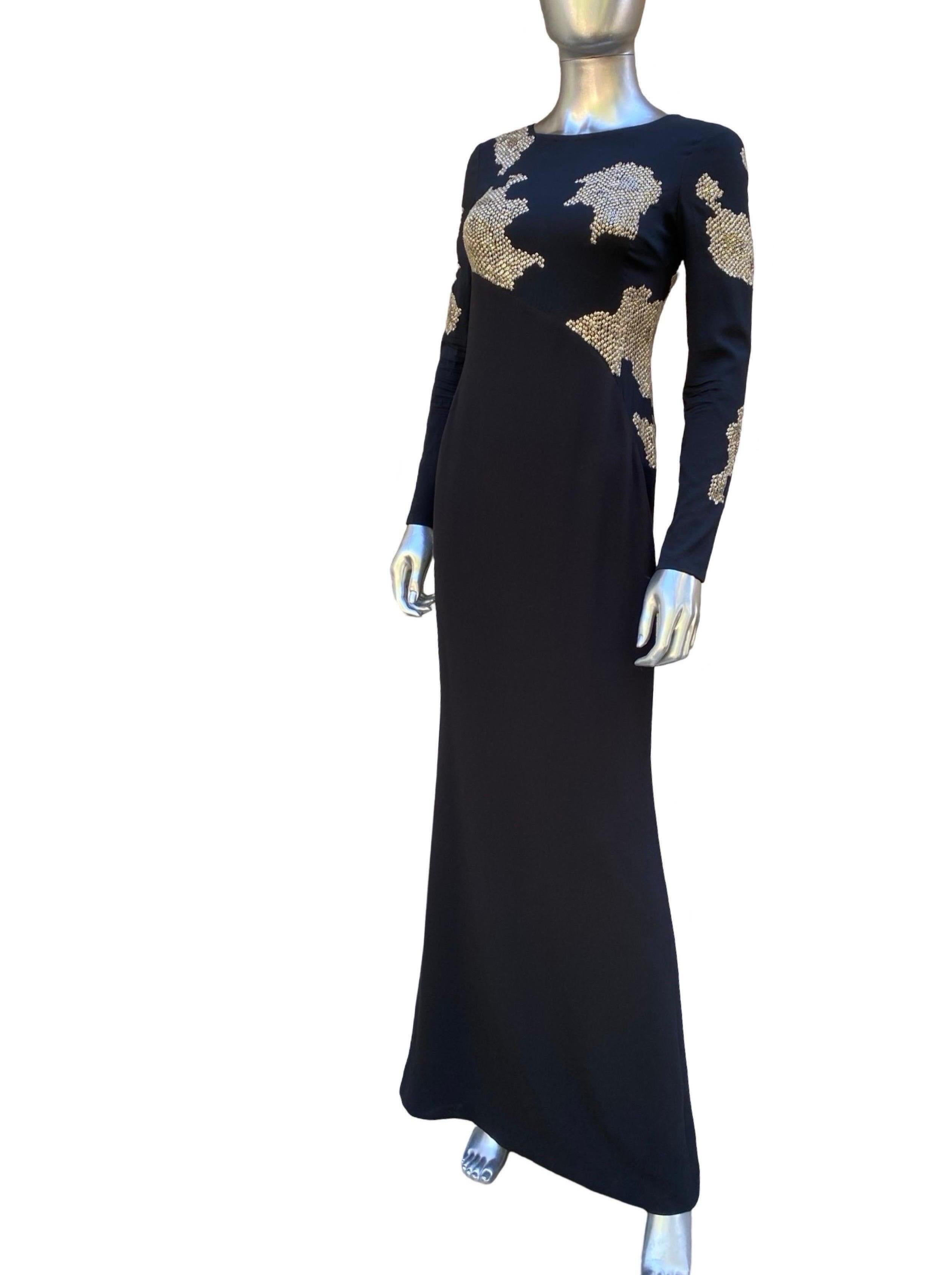 One of the best Escada evening dresses we have ever seen. As modern and chic now as it was when it was designed. A sleek “slinky” long dress made in Germany at the Eacada factory. The workmanship is amazing. The star of the dress is the
