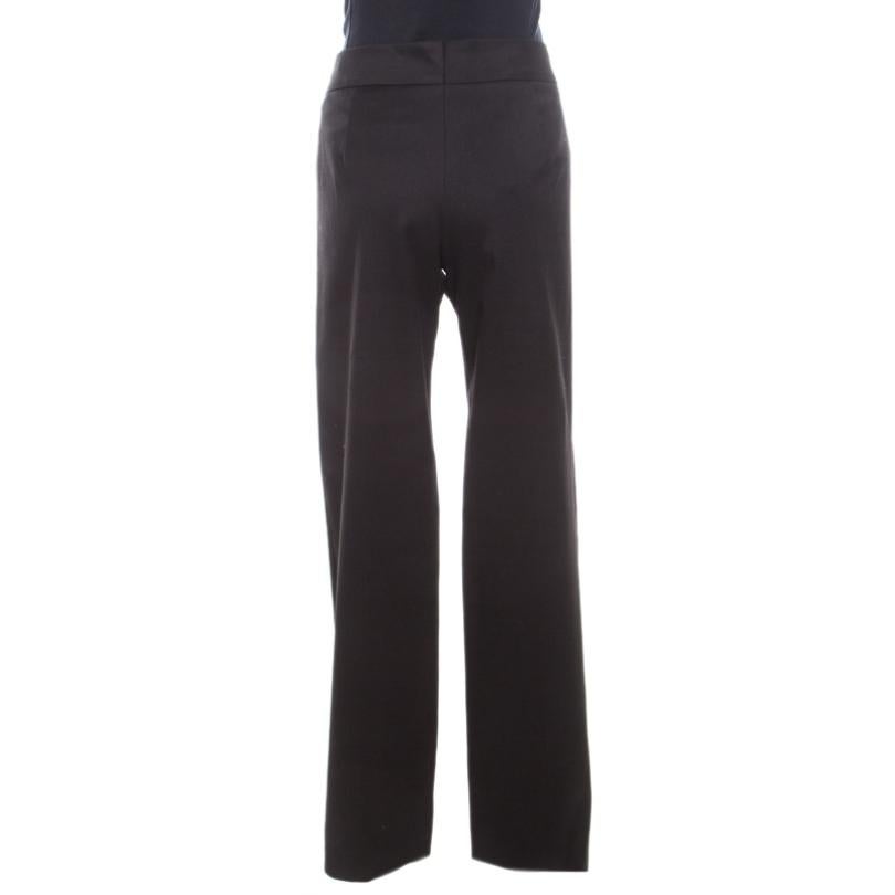 Tailored from a cotton blend, these wide-leg trousers will be an ideal purchase to add to your formal wear. These black Escada bottoms come with a zip closure and front fastening. The high waist trousers will work well with a fitted shirt and a