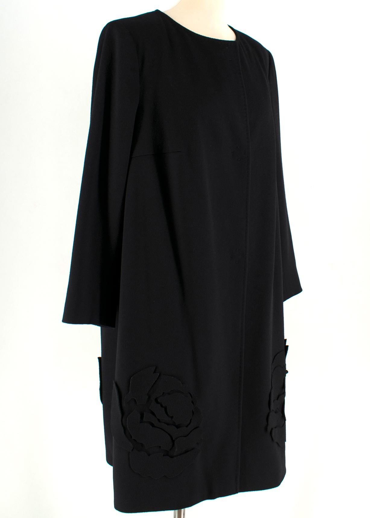 Escada Black Wool Blend Long Coat with Floral Embroidery

-Black, wool blend
-Floral embroidery on trim
-Light shoulder padding
-Concealed three-button closure 
-Unlined 

Please note, these items are pre-owned and may show some signs of storage,