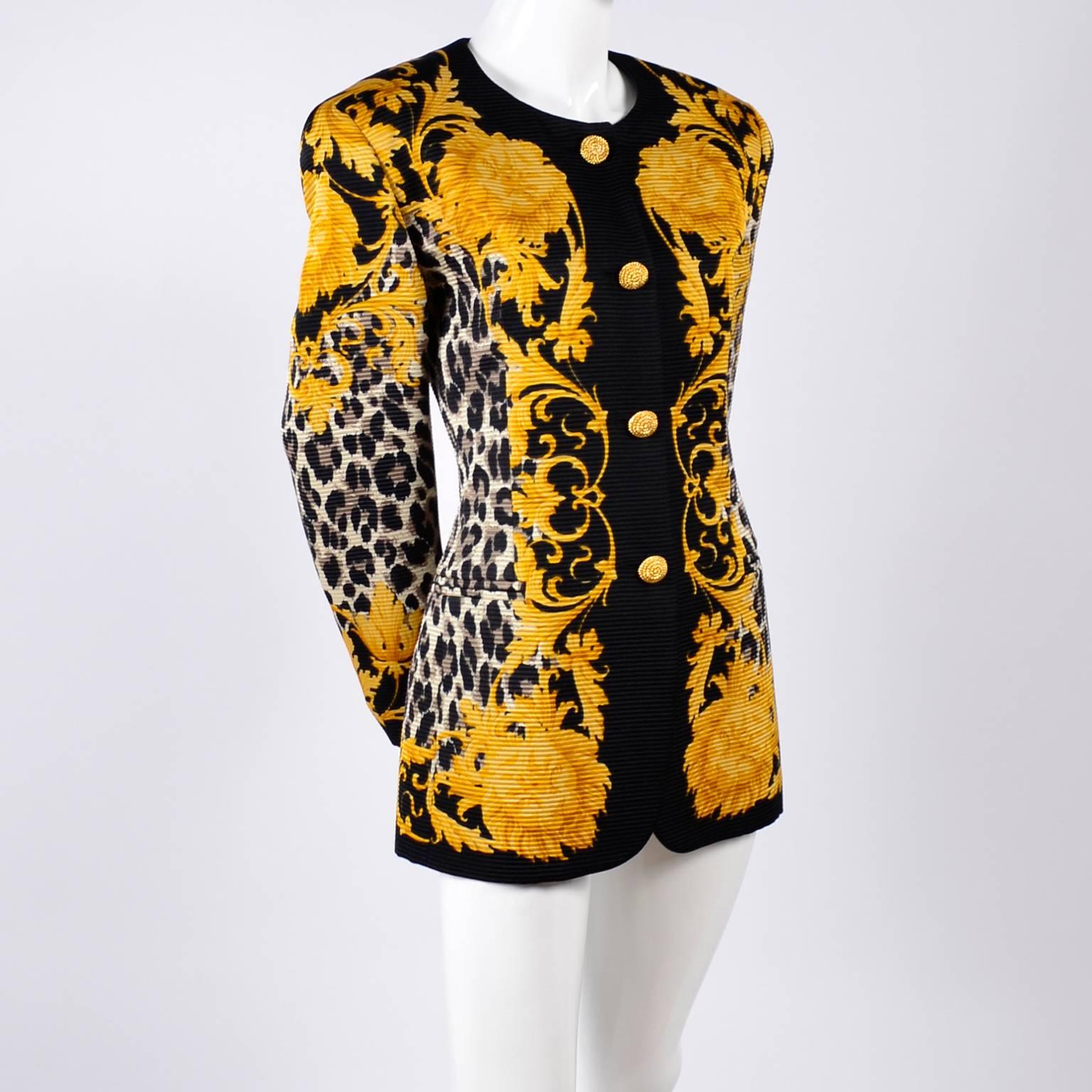 This is a beautiful ribbed silk baroque print blazer designed by Margaretha Ley for Escada.  The pattern of the jacket includes a black and brown animal print, yellow lion faces, yellow leaves and solid black trim.This vintage Escada jacket has a