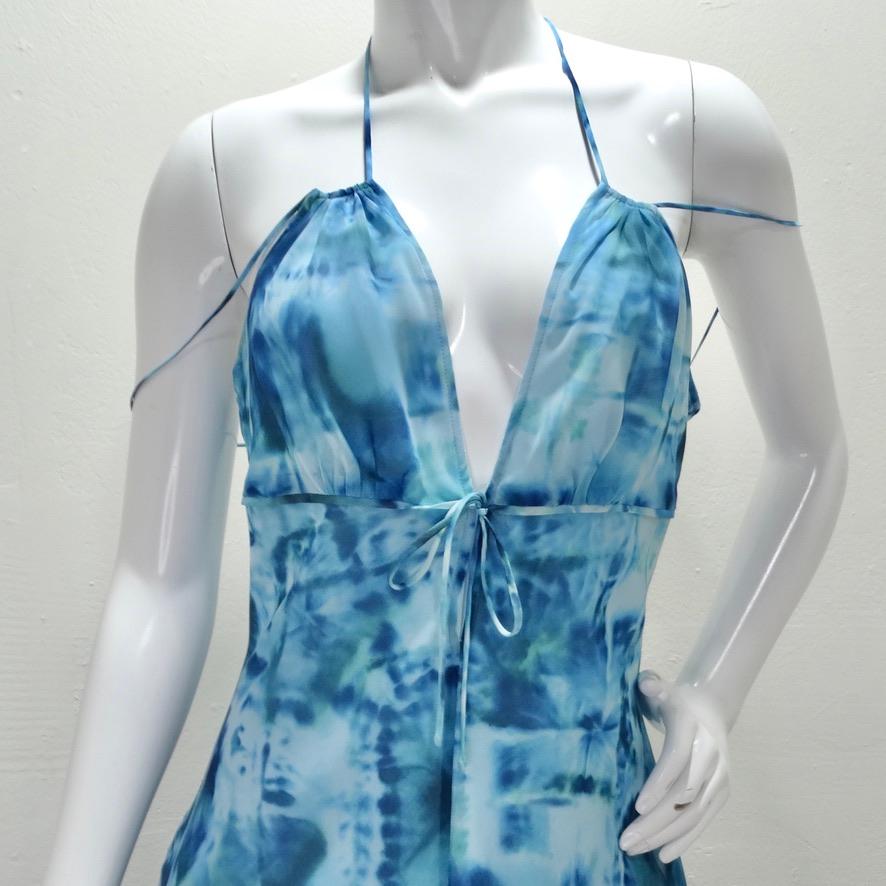 How stunning is this Escada tie-dye sun dress?! A beautiful 100% silk chiffon comes together with a poly lining and a sleek multi-strap detail at the center which draws in the eye and adds a unique touch. The dress is completed with a button closure