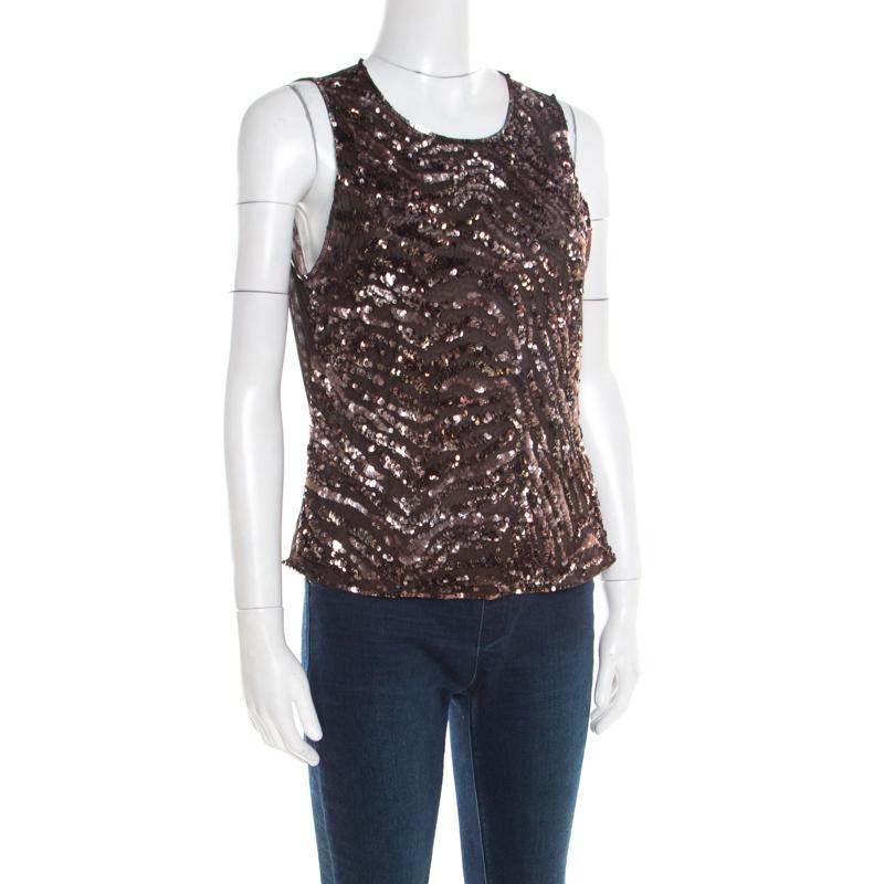 Isn't this sleeveless top from Escada just lovely! The brown creation is made of a nylon blend and features a flattering silhouette. It has been embellished with sequins all over on the front and flaunts a round neckline. It comes equipped with a