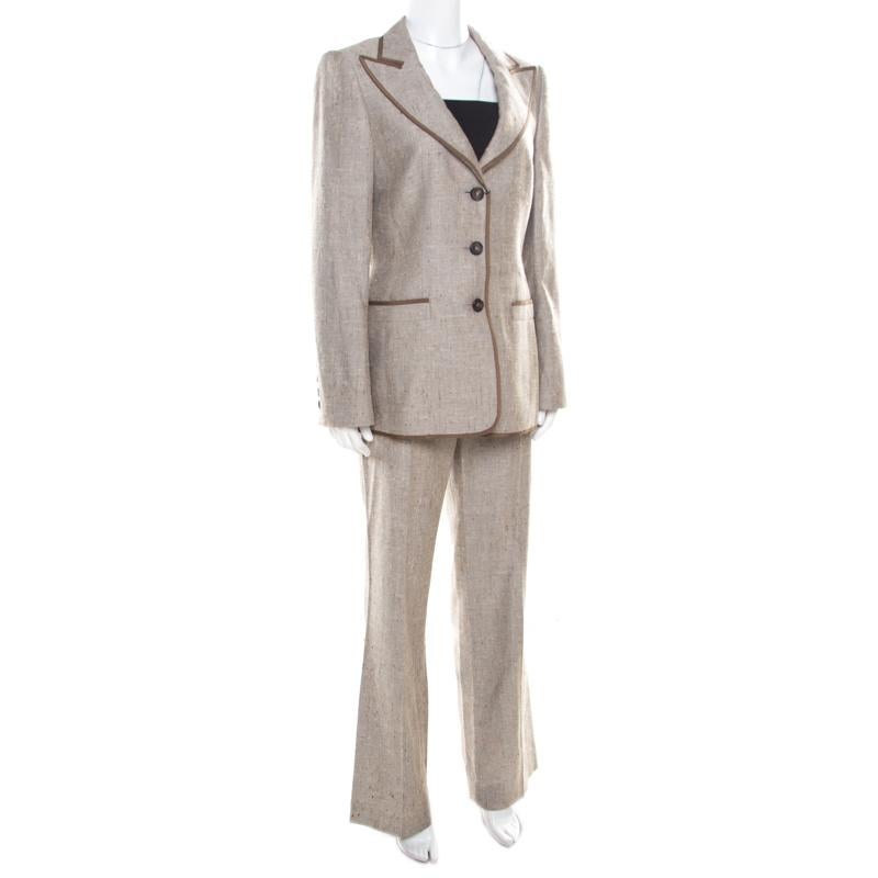 Nothing gives you a better style than a well-tailored suit. This one from the house of Escada is a classic creation meant to elevate your formal look. Cut from a blend of quality fabrics, the blazer features a notched collar and buttoned front