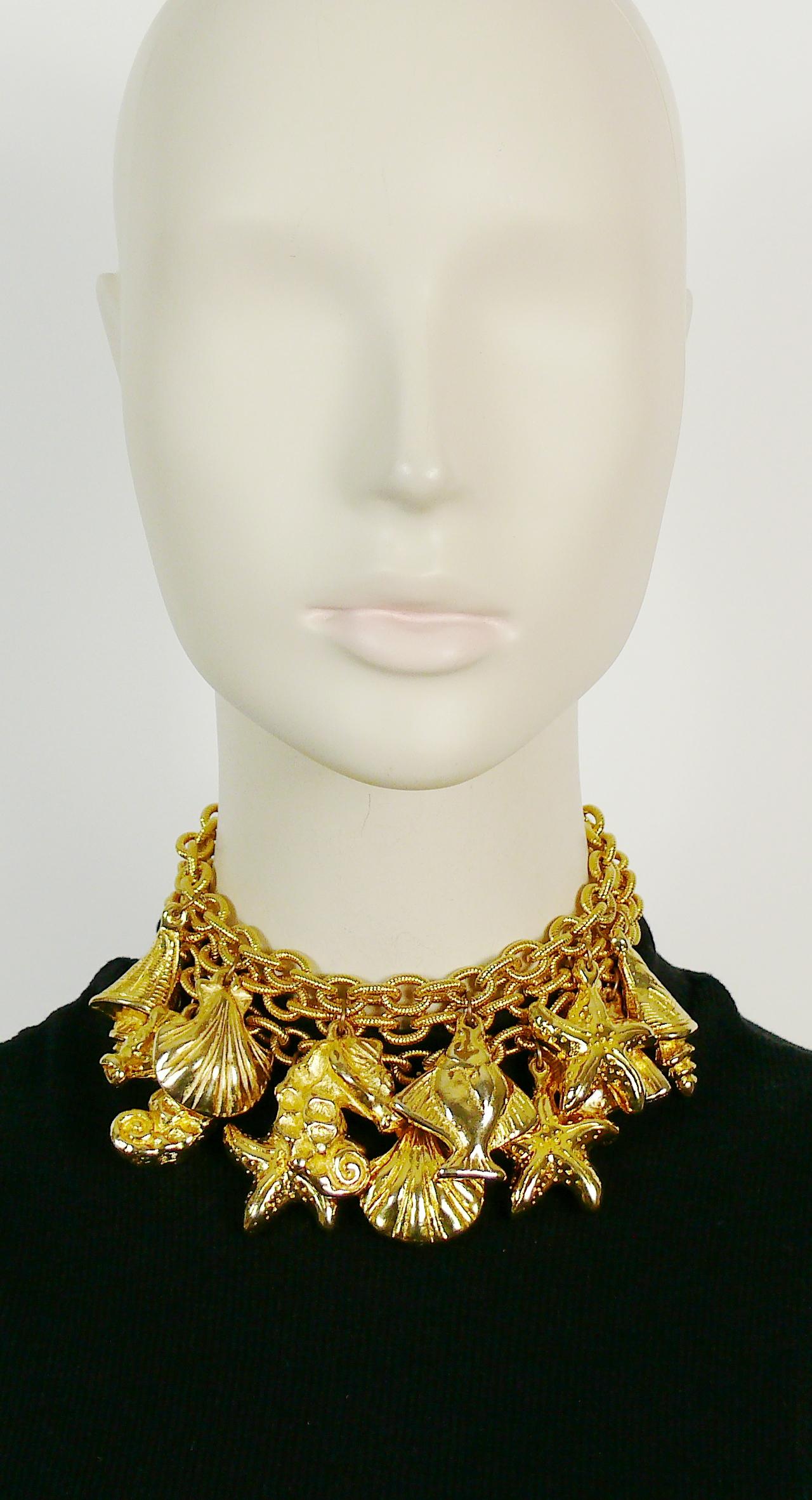 ESCADA by MARGARETHA LEY vintage gold toned mutistrand chain choker necklace featuring sea life charms : sea ​​horses, starfishes, shells, fishes.

Spring clasp closure.
Adjustable length.

Embossed ESCADA.

Indicative measurements : adjustable