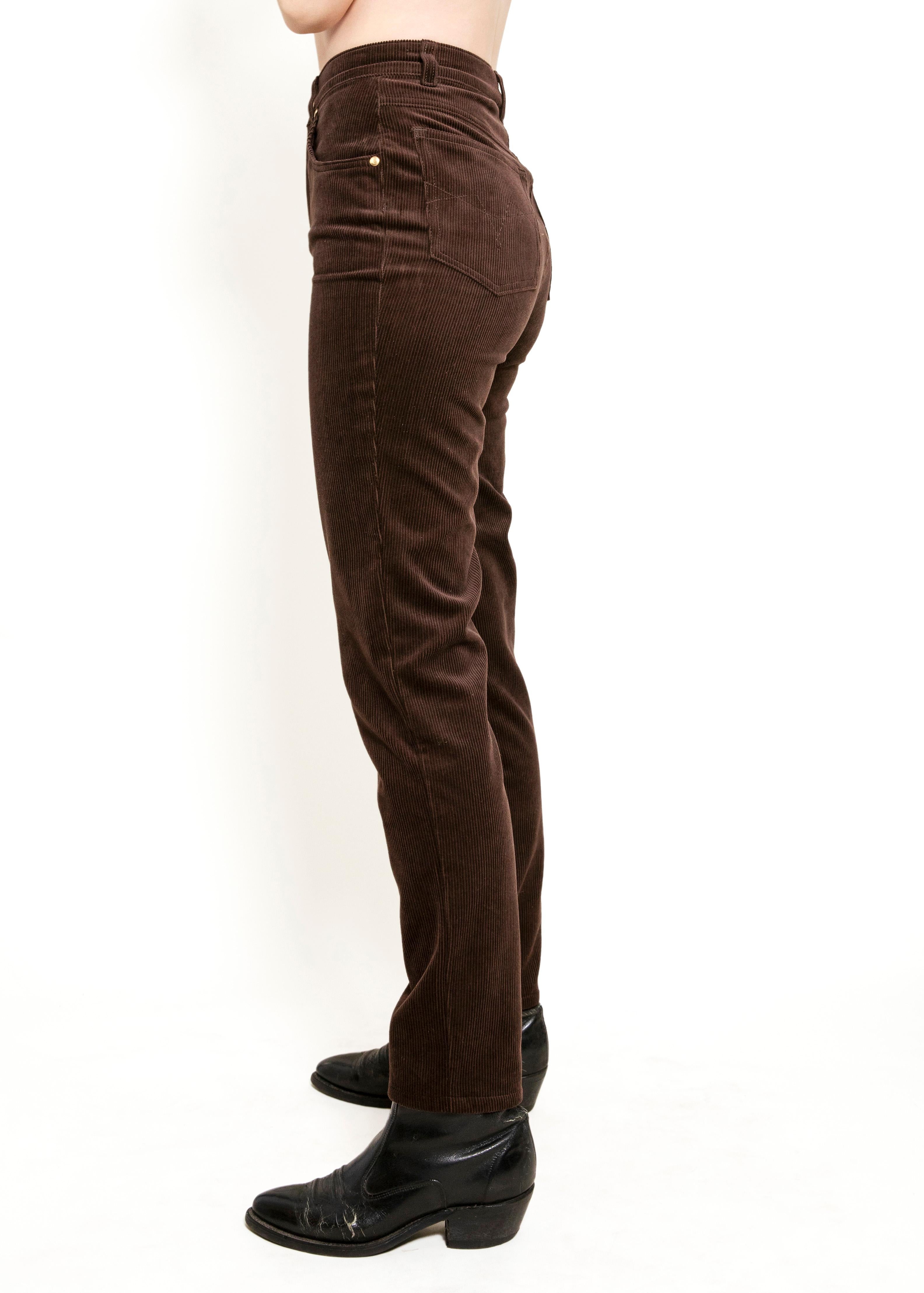 Take a risk and elevate your wardrobe with Escada Choc Brn Corduroy Pants. Featuring a high waist and flattering fit in a rich chocolate brown color, these pants are both daring and stylish. Perfect for those who want to stand out and make a