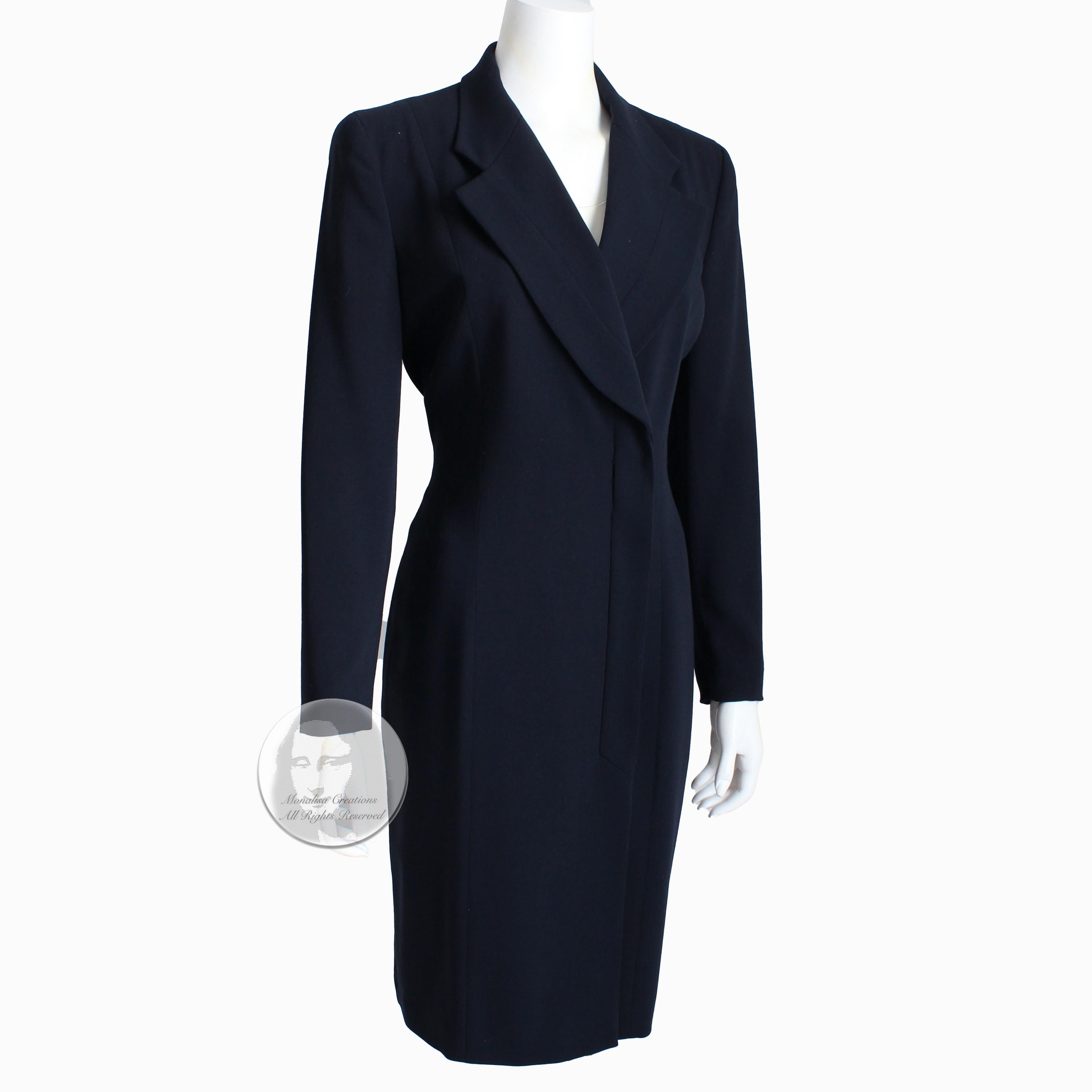 Authentic, preowned, vintage Escada Margaretha Ley dark navy wool coat dress, likely made in the 90s. Made from a dark navy new wool gabardine fabric, it's lined in satin and fastens with hidden buttons.   

Perfect for work - or for any time you're