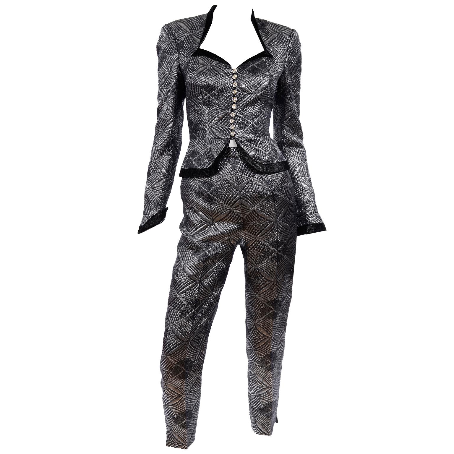 This stunning vintage Escada Couture evening ensemble includes a long pleated grey and black taffeta striped skirt, a pair of pedal pusher style slim trousers and a peplum jacket top in a textured silver and black lurex fabric with sueded black