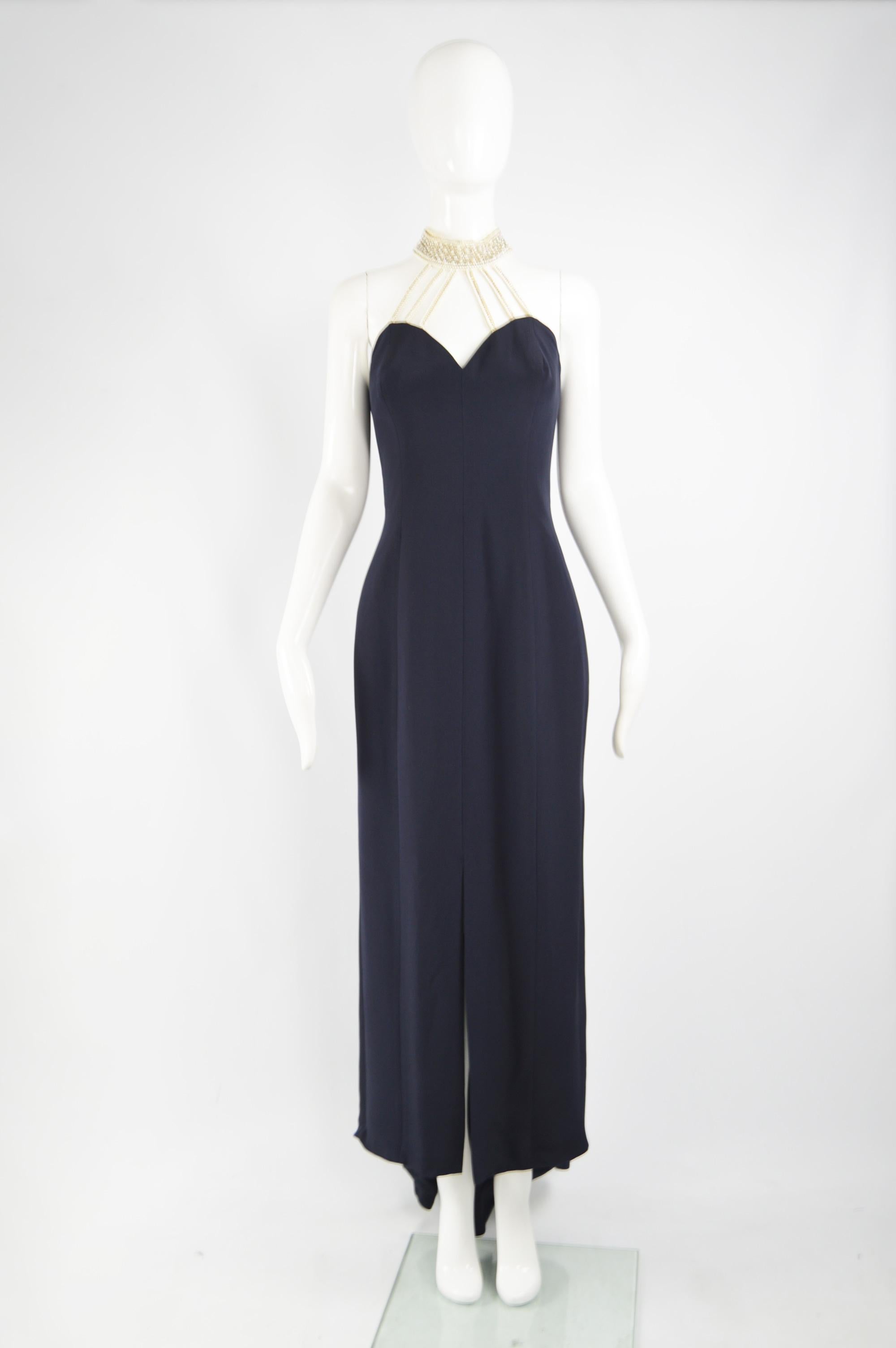 A fabulous vintage Escada evening gown from the 90s for their high end Couture line. In a blue silk and polyester with faux pearl beads creating a choker style neckline. Perfect for a formal party or red carpet event. 

Size: Marked EU 40 which