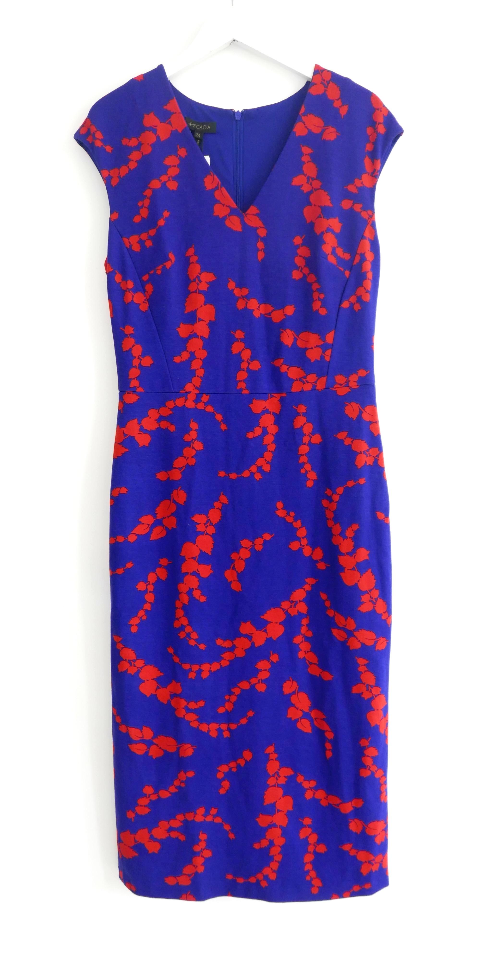 Absolutely gorgeous Escada Danhi Fantasy Print Cap Sleeve Dress. Bought for $1095 and w with tags. Made from smooth, stretchy viscose mix jersey in cobalt bright blue with a scarlet red draped leaf print. It has a super flattering and comfy for