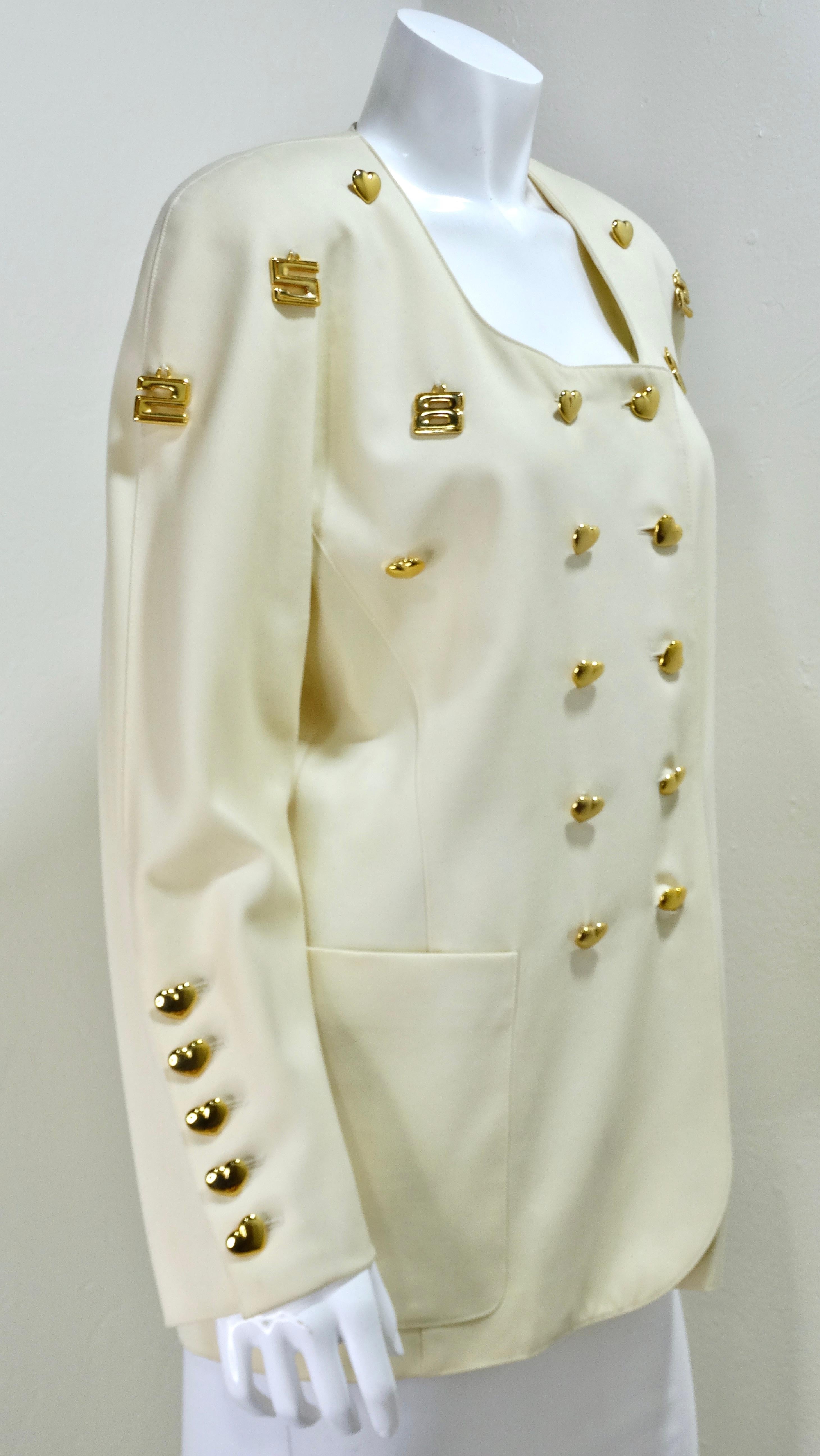 This funky retro Escada jacket is a stunning addition to any wardrobe. This features a 100% wool composition with gold metal charms and hardware including two columns of heart-shaped buttons line the front and the arm cuffs and hanging numbers 2, 5,