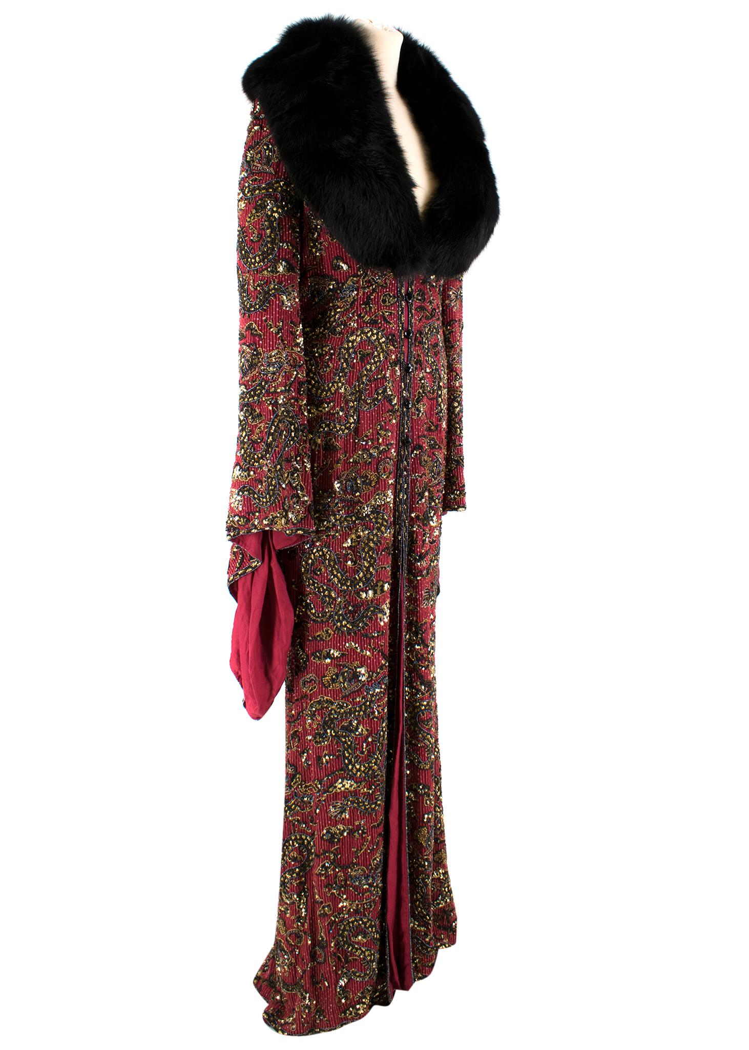 Escada Embellished Vintage Gown 

-Deep maroon-red heavyweight vintage silk gown.
-Gold-tone, black, red and gunmetal ornate bead embellished
- Detachable black fox fur collar
-Long oversized bell sleeves
- Centre-front half Rouleau button