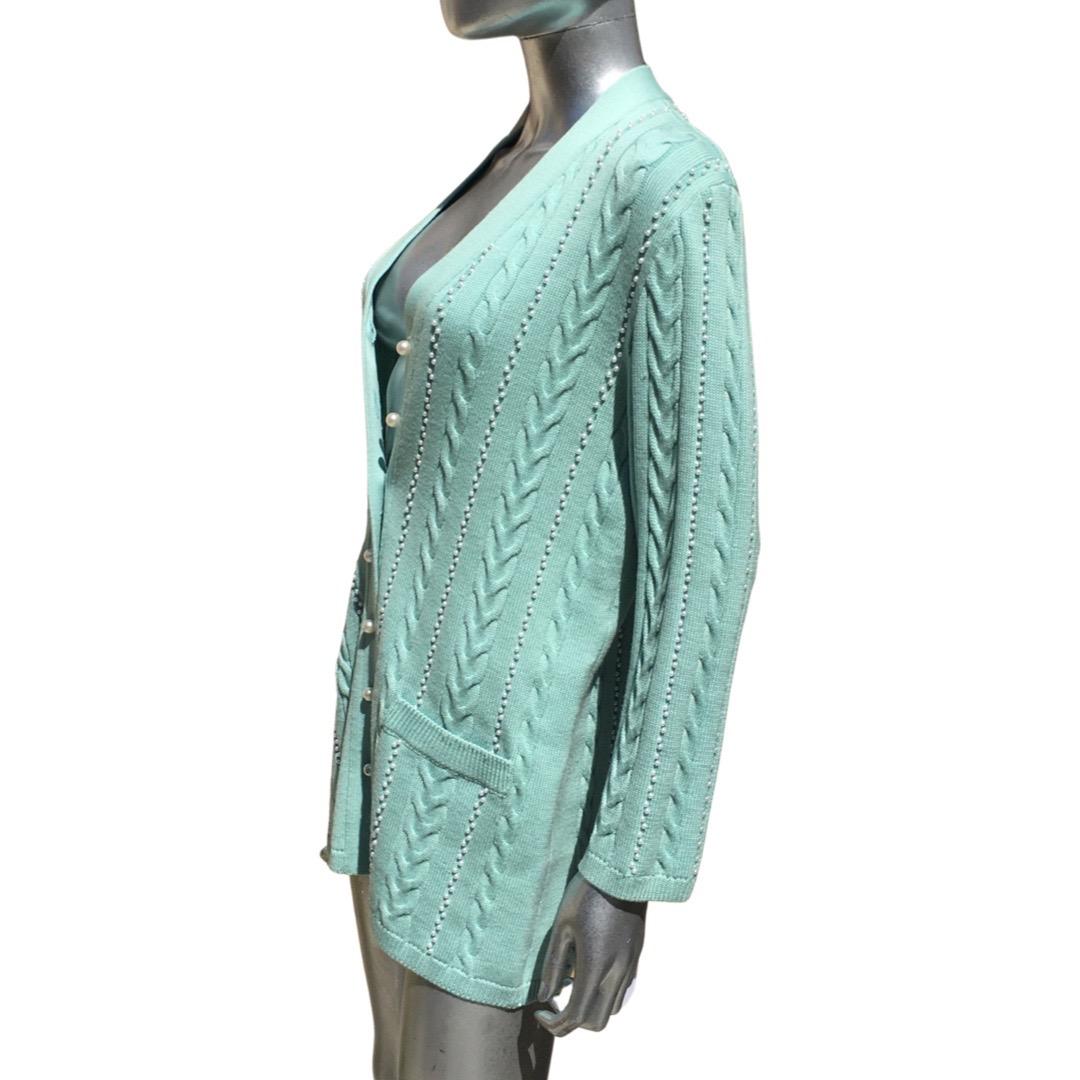 Escada Germany designed/made this beautiful stylish sweater in mint green fine wool. (sweater is not hot or heavy). This very special cardigan sweater is embellished with hundreds of small faux pearls on the front, back and sleeves.  The front