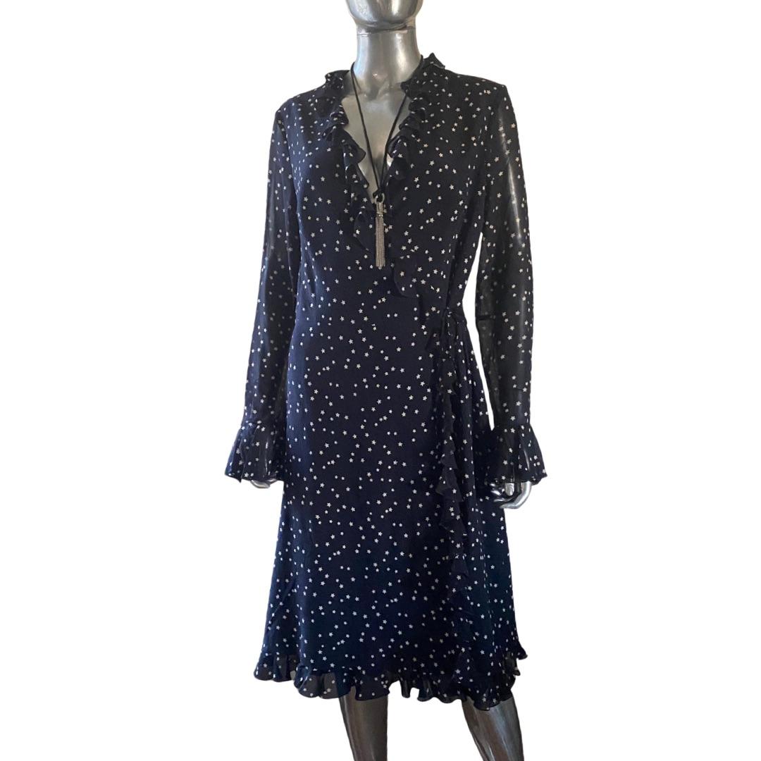 Such a beautiful and chic classic dress made by Escada when everything they used to do was made in Germany. This hundred percent silk dress is lined except for the sleeves where you can see skin through the chiffon print. Black silk with tiny white
