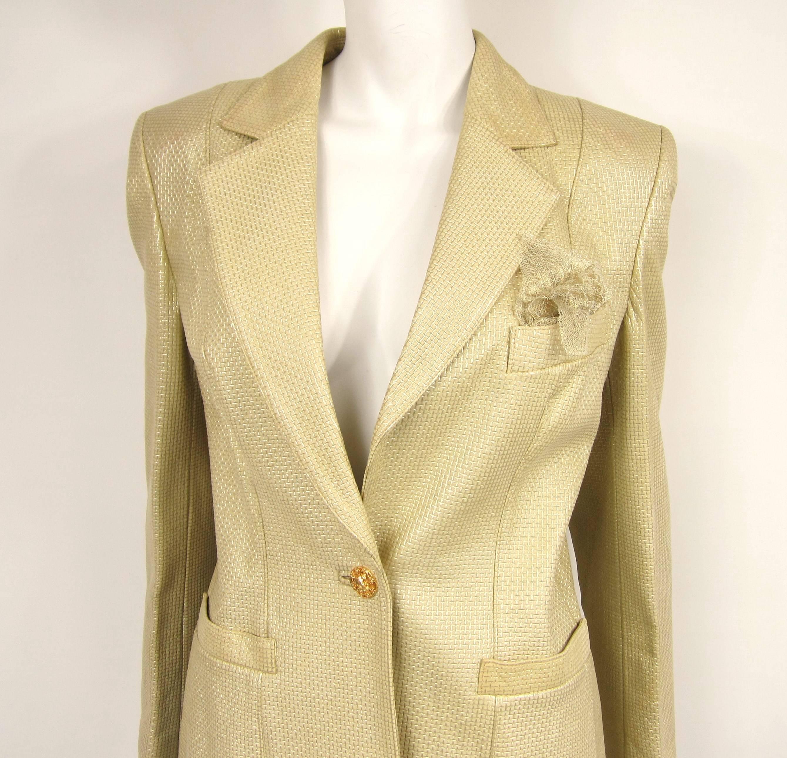 One button Escada Leather blazer out of a collection of Escada we have that still has the price tags attached. Lace hankie in the pocket. 2 slit front pockets. Up to 36 in.  Bust -- Up to 30 on.  waist -- Up to 36 in.  hips -- 24.5 in. sleeve--