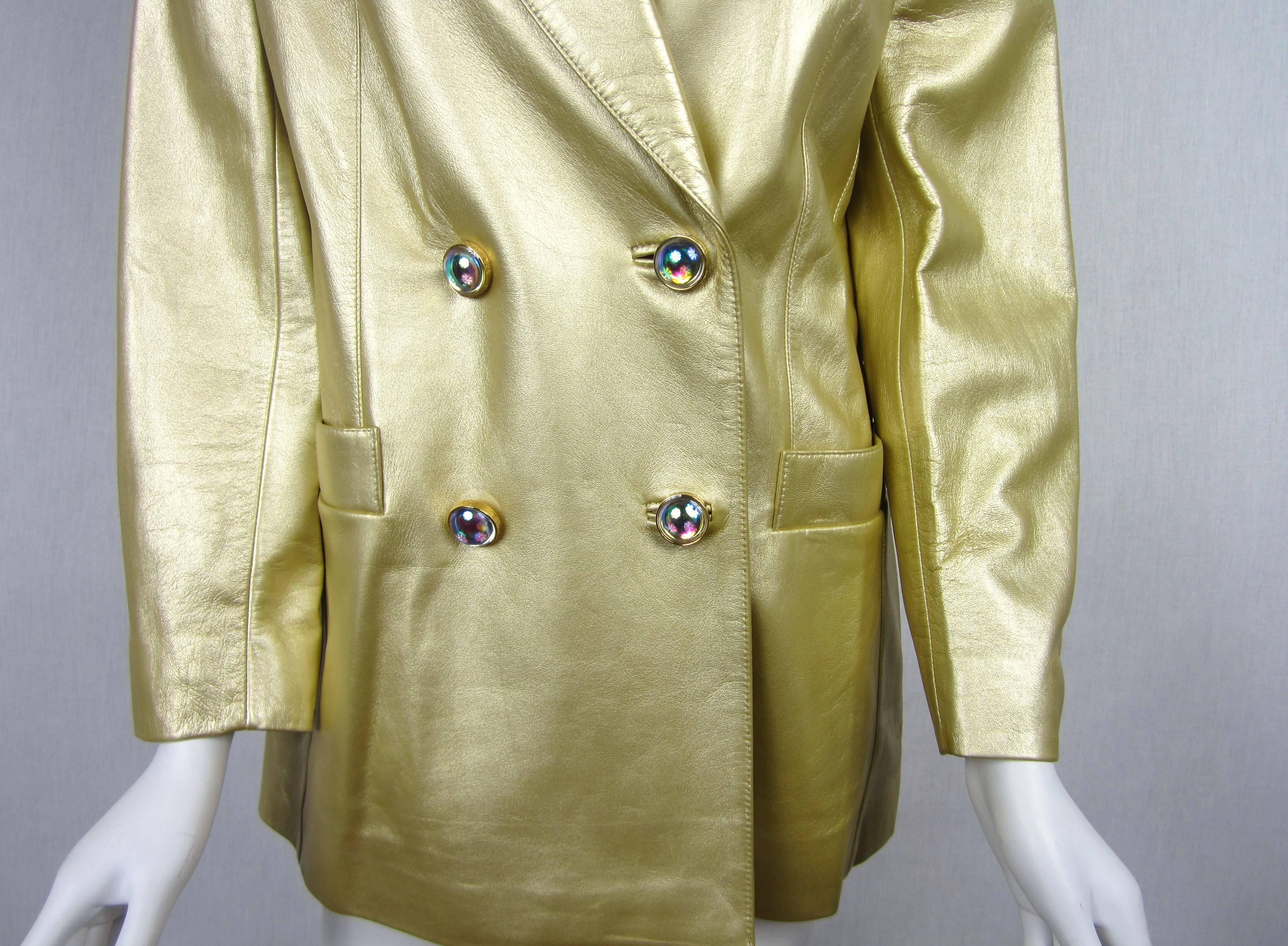 Fabulous Escada Gold Shimmering Leather Double Breasted Blazer. Stunning aurora borealis colored bubble buttons with Slit pockets, Lined. Shimmering Gold Leather. UK 38 Will fit a medium.   Please be sure to check our storefront for more fashion as