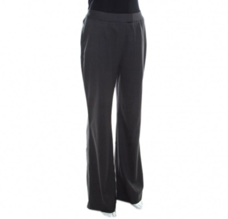 Questi pantaloni elasticizzati di Escada parlano di comfort e facilità. Sono stati realizzati su misura in lana con gambe larghe e vita alta. Indossali con top in seta e décolleté per un ensemble formale.