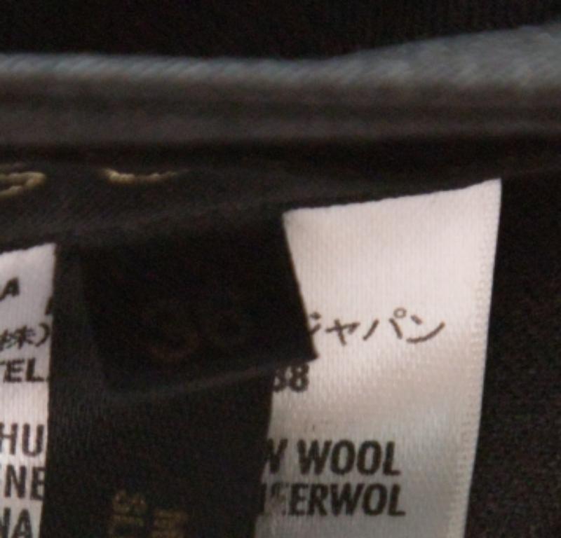 Escada, pantaloni a vita alta e gamba larga in lana elasticizzata di colore grigio M. I. In condizioni buone in vendita a Dubai, Al Qouz 2