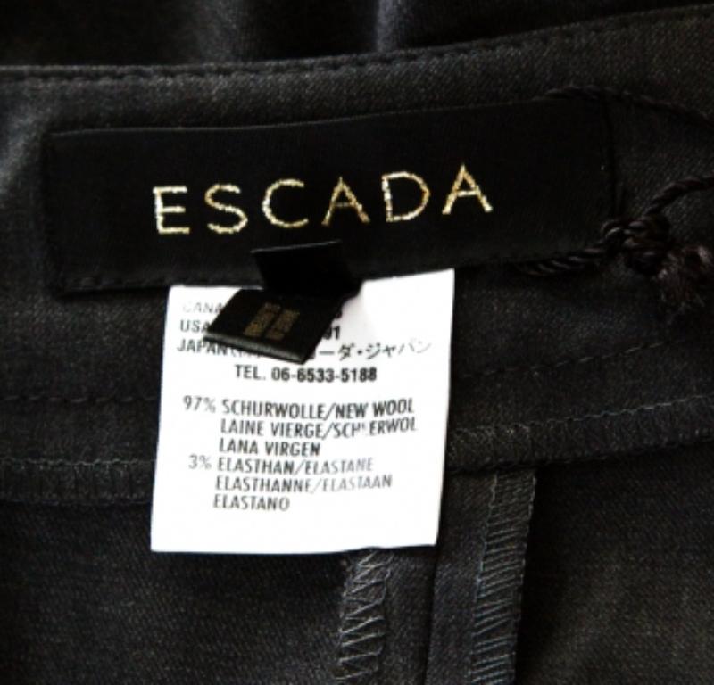 Donna Escada, pantaloni a vita alta e gamba larga in lana elasticizzata di colore grigio M. I. in vendita