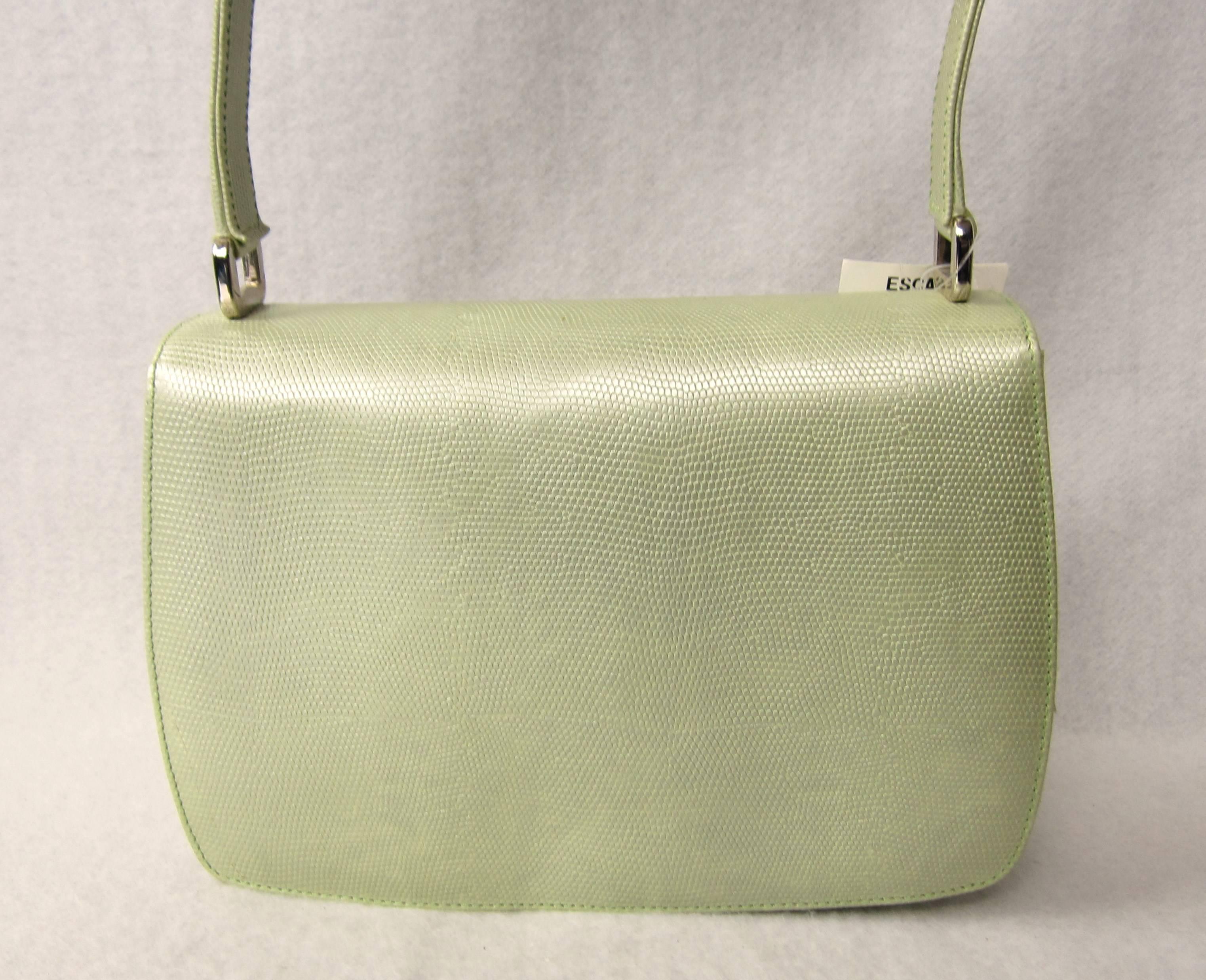 Pearlized Soft Green color Reptile Embossed Leather Box Shaped Shoulder bag Purse with SILVER tone Escada Clasp Logo on the top of the handbag. The color is very soft lime green. The tag color 450-lime Style 1620-450 Made in Italy -- 8-7/8  across