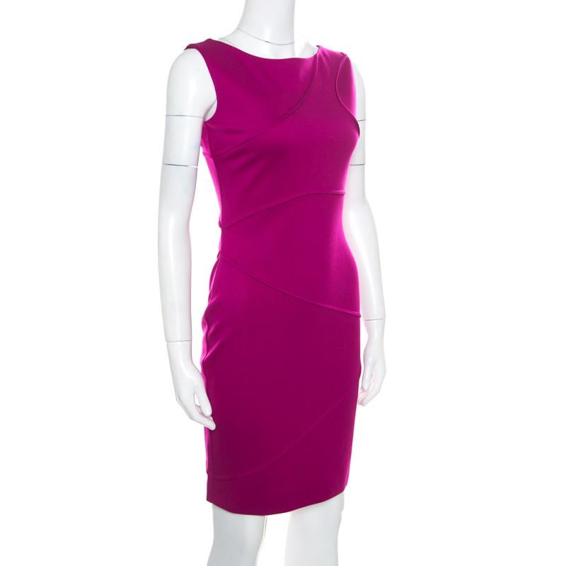 This creation by Escada is so perfect it will not only give you a fabulous fit but will also lift your spirits because wearing good clothes can give one a pleasant feeling. In a gorgeous purple shade, this bodycon dress flaunts a sleeveless style