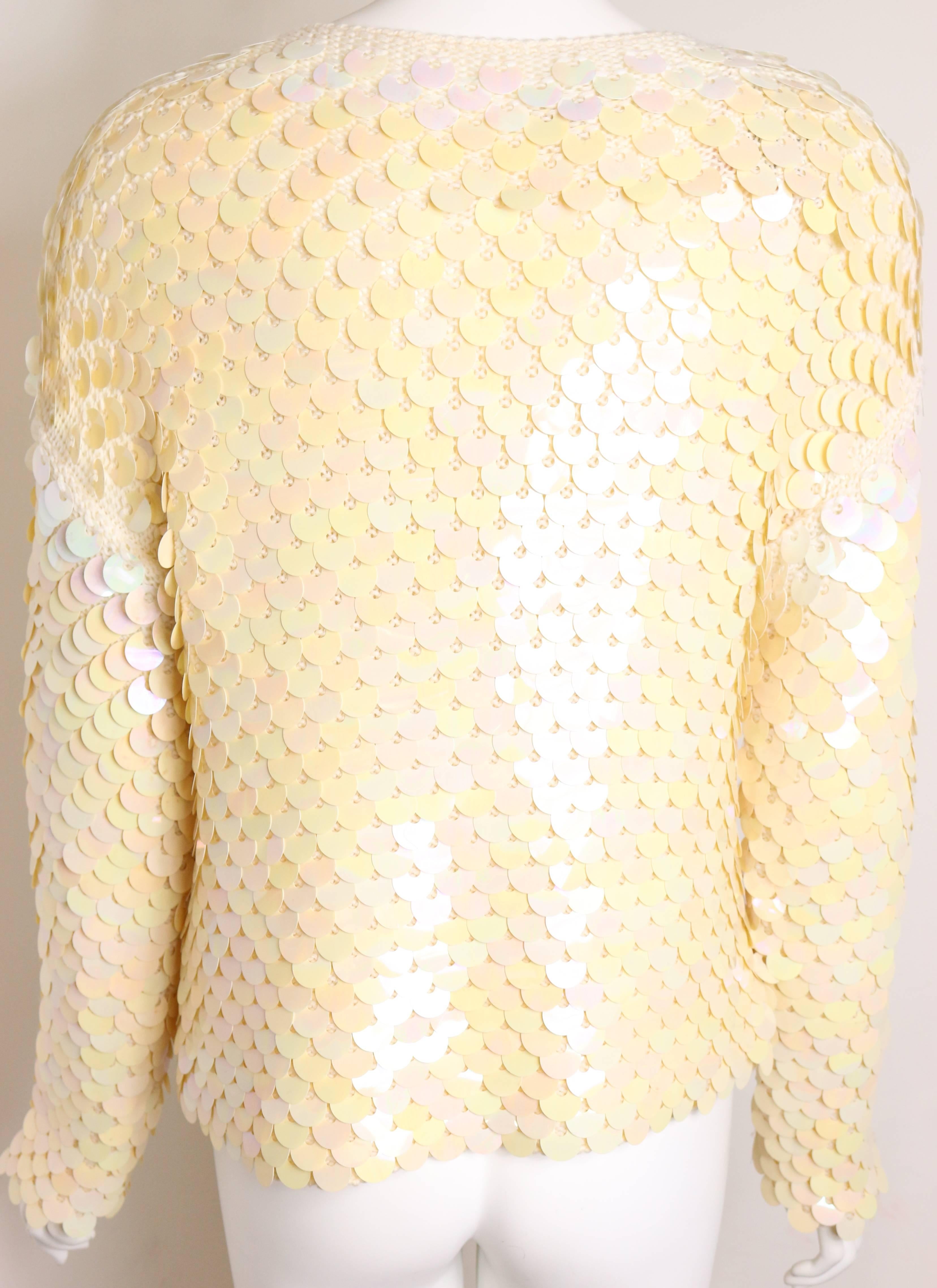 - Vintage 80s Escada ivory sequins knitted top. 

- Size 36. 

- Attached with an original tag, never been worn but some of the sequins has discoloured.