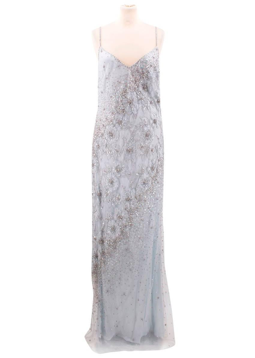 Escada light blue embellished gown. 
Made in Italy. 

Features a V-neckline, concealed back zip, embellished in sequins and beads on surface of dress and floral embroidery. 

Fabric: 67% Rayon, 18% Nylon, 11% Cotton,4% Polyester,100% Silk. 

Size:
