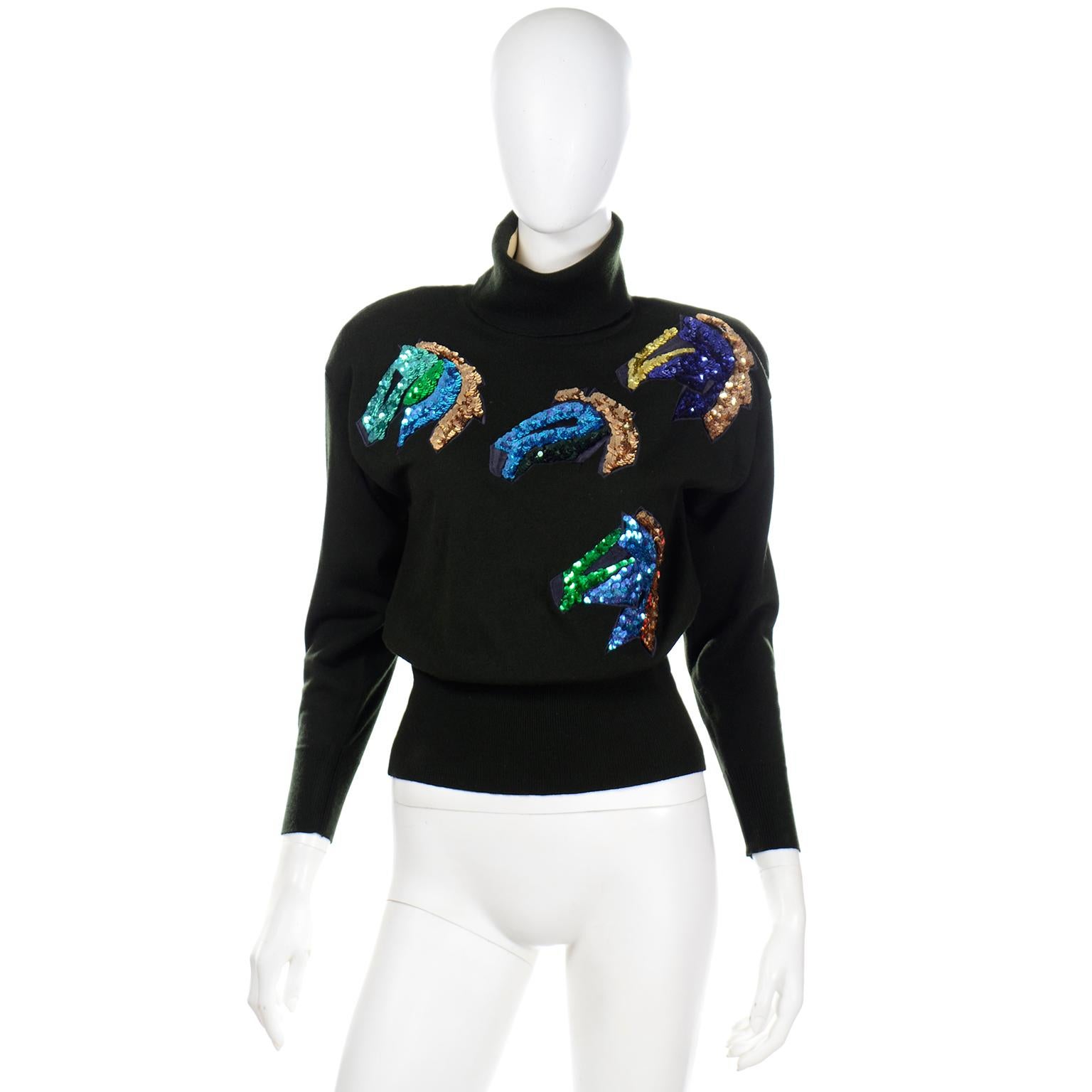 This is a really fun, beautiful vintage Escada black turtleneck sweater embellished with blue, green, copper and black sequin horse heads.  Margaretha Ley loved horses and this novelty sweater is a great example of how she turned a theme into a high