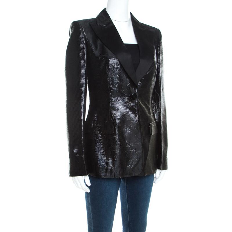 This Escada blazer is designed to lift your wardrobe. The blazer features peak satin lapels, front buttons and a metallic black exterior. Tailored to fit you perfectly, this piece will offer a quintessential urban look.

Includes: The Luxury Closet