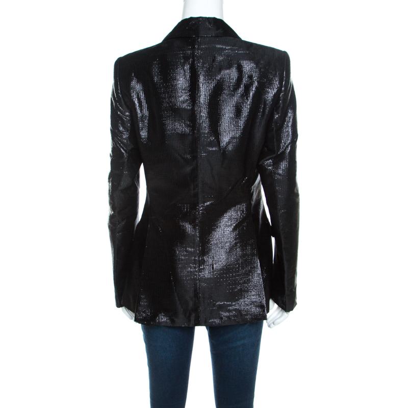 This Escada blazer is designed to lift your wardrobe. The blazer features peak satin lapels, front buttons and a metallic black exterior. Tailored to fit you perfectly, this piece will offer a quintessential urban look.

Includes: Price Tag, Info