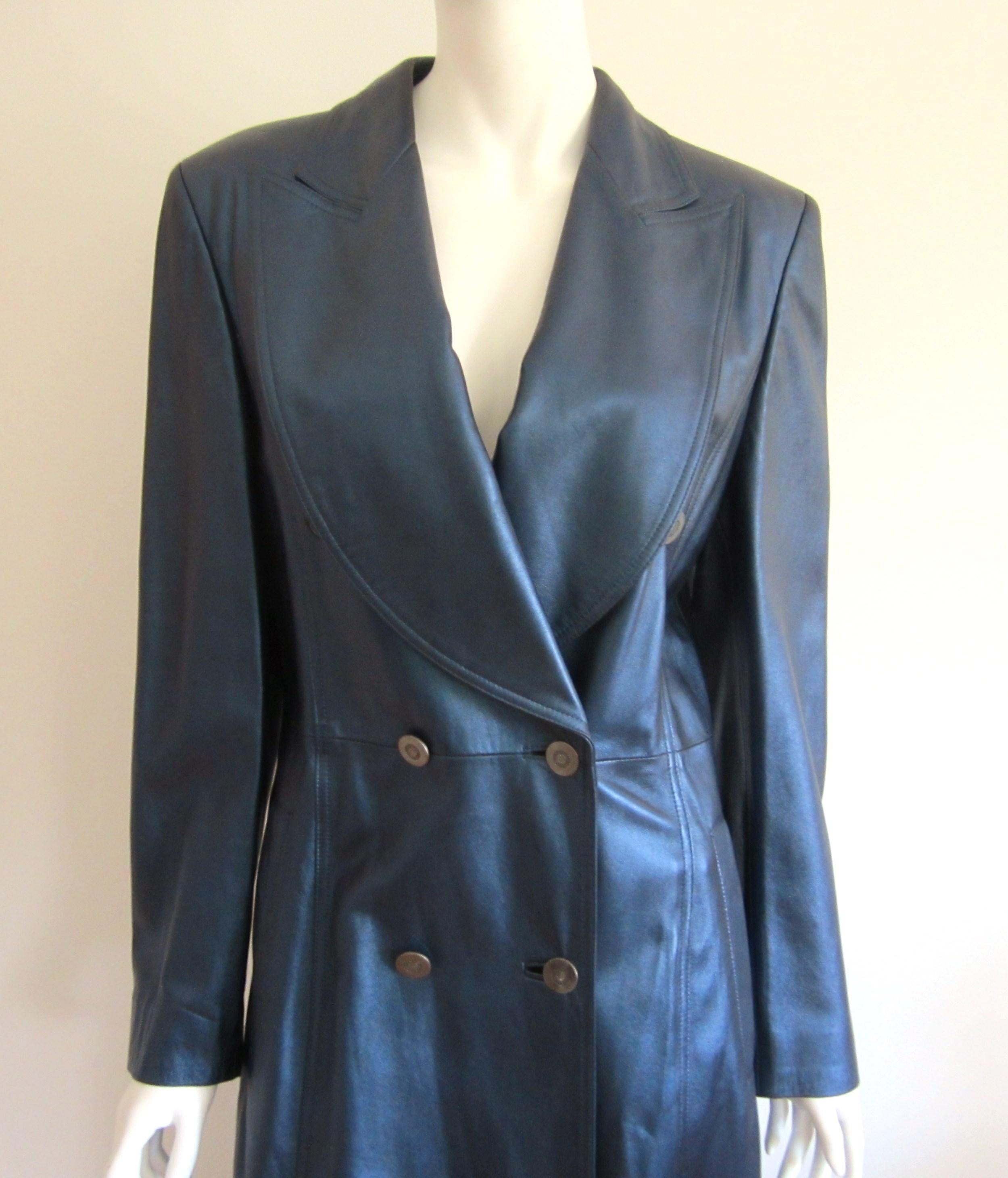 Stunning supple Escada Metallic Blue Leather Double Breasted trench coat. Detailing on this is fantastic. Faux belt, Slit pockets This was purchased back in the late 1980s early 1990s and never worn. Price tags still attached. Measuring labeled a