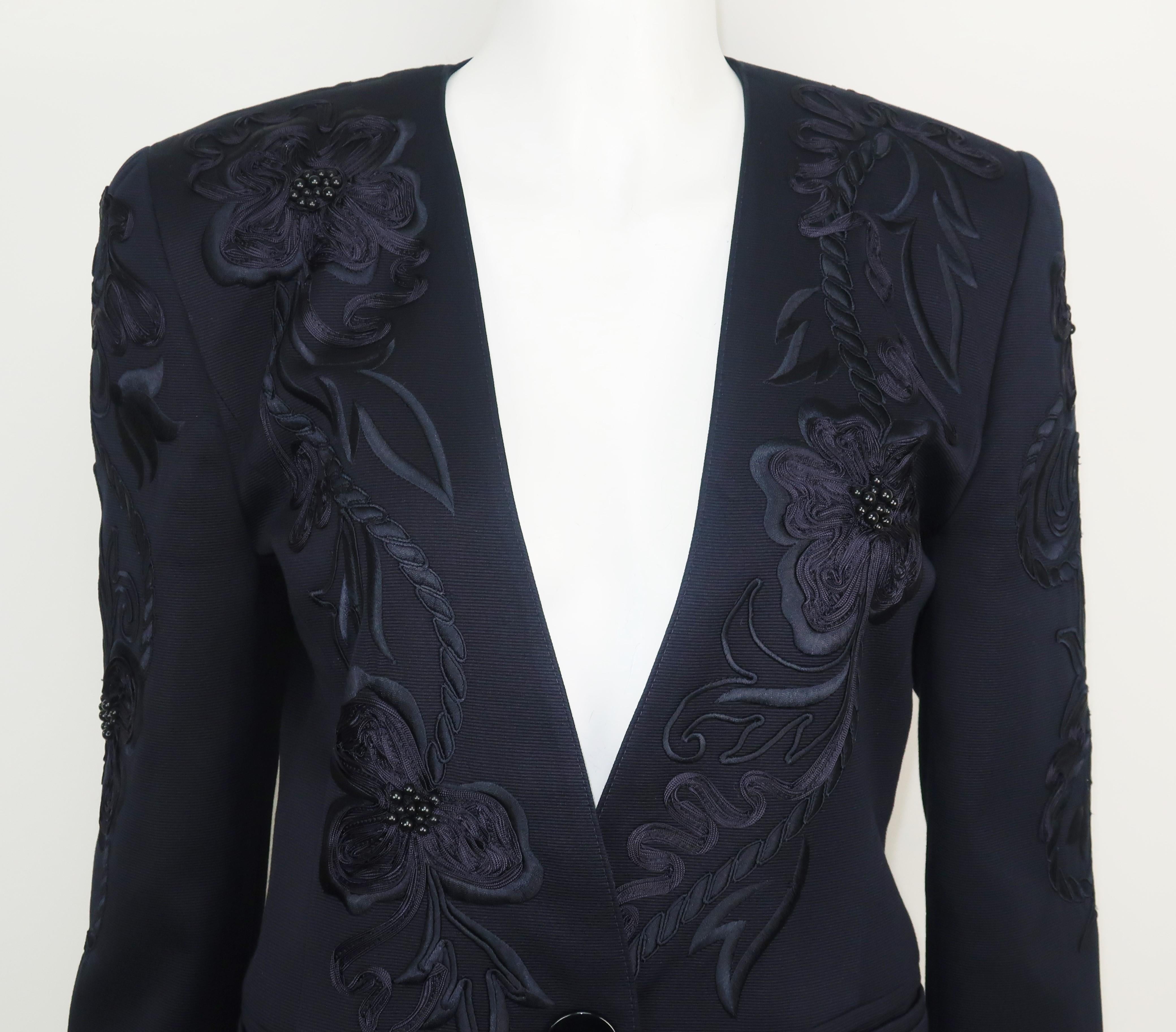 This beautiful midnight blue cotton faille jacket by Margaretha Ley for her Escada label offers a polished look for warm weather evenings.  The collarless jacket buttons at the front with pockets and has a 1940's style menswear look created by