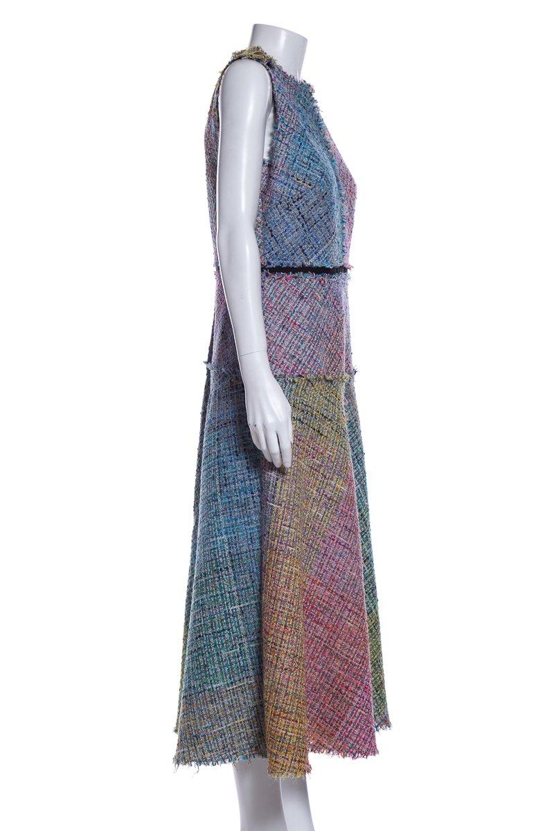 Escada multi color sleeveless tweed dress with panel and frayed edge detail and back zip closure.