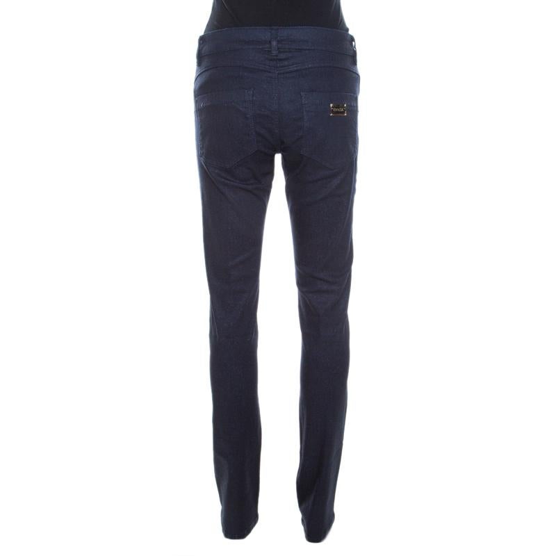Tailored from a cotton blend, these Escada jeans are designed in a straight leg fit. This navy blue glitter denim features five external pockets, belt loops, zip closure and the brand logo on the back.

Includes: The Luxury Closet Packaging, Price