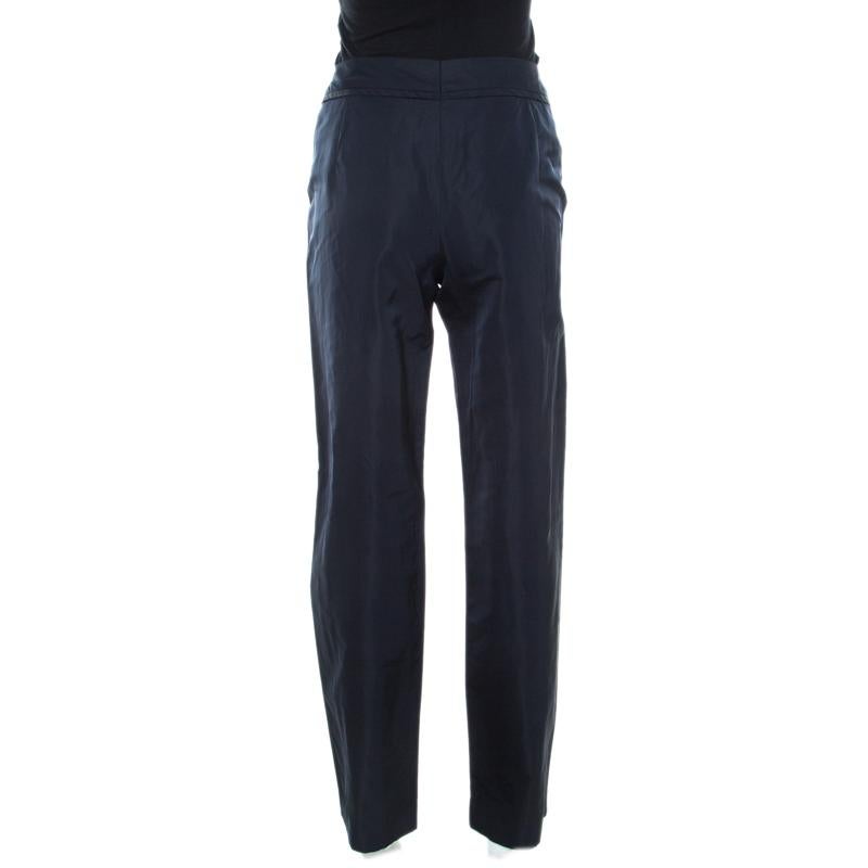 This pair of pants from Escada is absolutely delighting. It comes tailored from quality fabrics and designed to offer a straight fit. These navy blue trousers will work well with a silk shirt and bright sandals.

Includes: The Luxury Closet