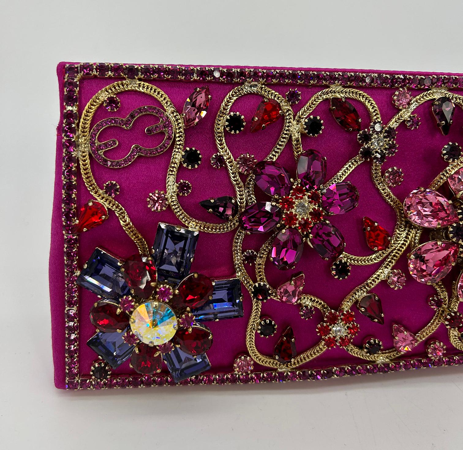 Escada Pink Silk Jeweled Rhinestone Pochette Clutch in excellent like new condition. Pink silk exterior trimmed with gold chain and multicolor rhinestones along front side. Gold chain sewn into front with pink rhinestone border and signature EE logo