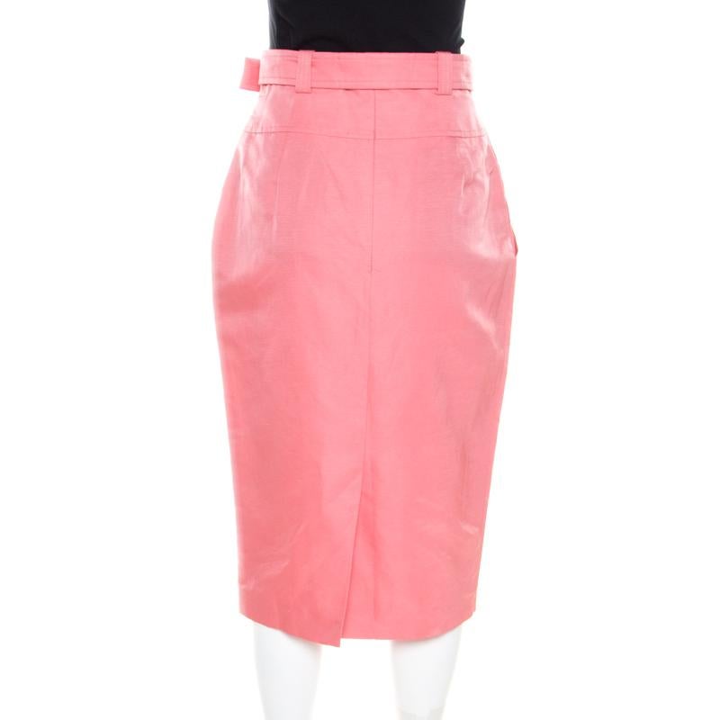 Our hearts are racing for this spellbinding skirt from Escada. It is tailored using linen as well as silk and it has a belted waistline and a hem that falls below the knees. You can team it with a white blouse and bubblegum pink sandals.

Includes: