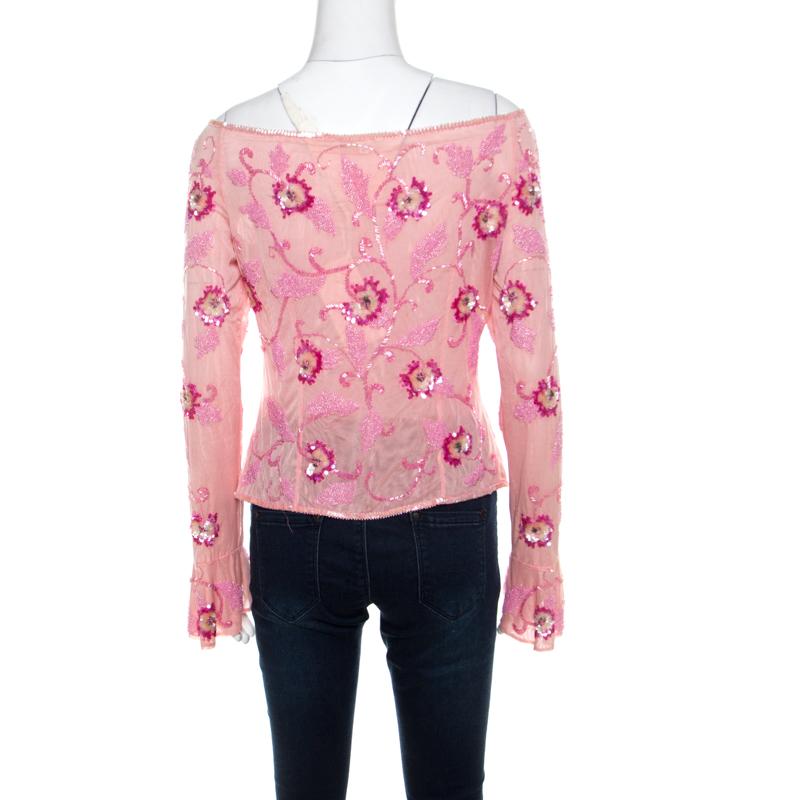 Escada offers a diverse range of the best styles and this top vouches for it. Designed in an off-shoulder style, the blouse is embellished with crystals and sequins all over for a feminine appeal. The use of pink colour in this makes it an absolute