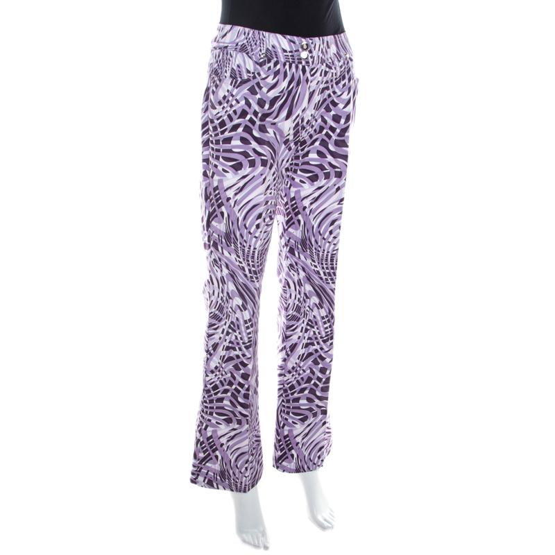 We have our eyes on this pair from Escada as it is very fashionable. The trousers are detailed with abstract prints and come made from cotton and elastane in a flared style. You can pair it with a summer shirt and wedge sandals.

