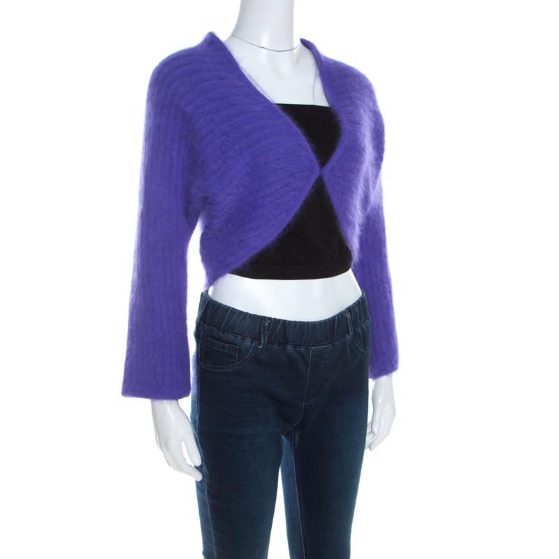 Flaunt your casuals with this charming piece designed by Escada. Made from blends of fine fabrics, this comes in a bright purple shade. This Fuzzy Bolero features a button front closure and long sleeves. This creation will complete any basic look
