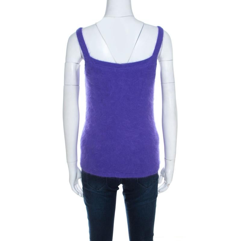 For days of warm style, Escada brings you this fuzzy tank top that has been made from angora blend and lined with silk. The purple top is soft as well as plush, and can be worn under cardigans or coats.

Includes: The Luxury Closet Packaging, Price