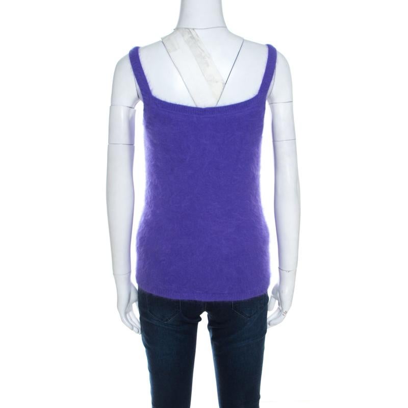 For days of warm style, Escada brings you this fuzzy tank top that has been made from an angora blend and lined with silk. The purple top is soft as well as plush, and can be worn under cardigans or coats.

Includes: The Luxury Closet Packaging,