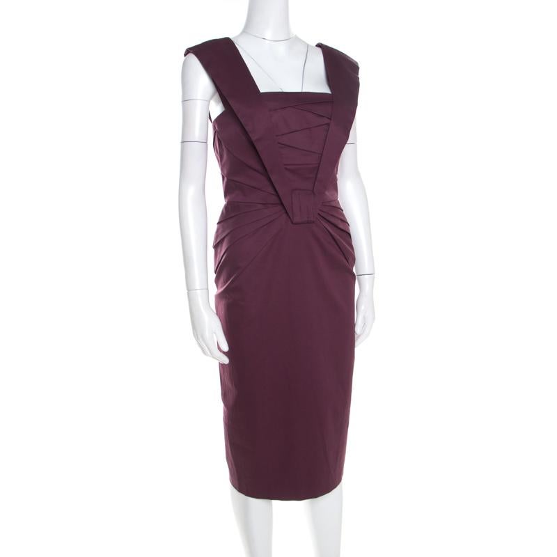 You must own this gorgeous dress from Escada as it will come in handy for days when you wish to look minimal yet elegant. Featuring pleat details on the bodice, zip closure and a hemline ending below the knees, this purple dress will offer you a