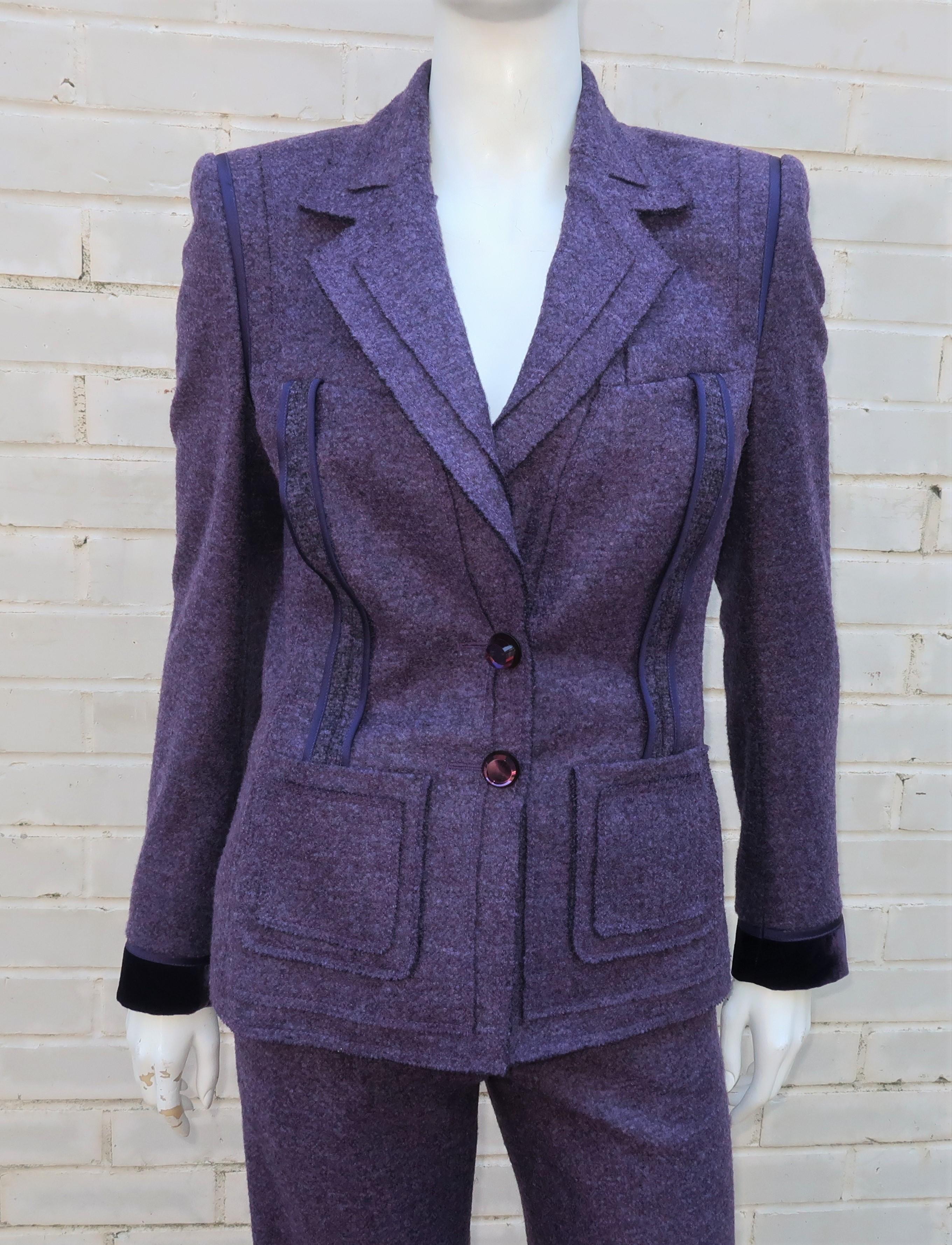 Escada suits are beautifully made and this purple wool pant suit is no exception.  It has a youthful style with unfinished edges and reversed seams on the jacket.  Two large mirror backed glass buttons, satin trim and velvet cuffs add a bit of glam